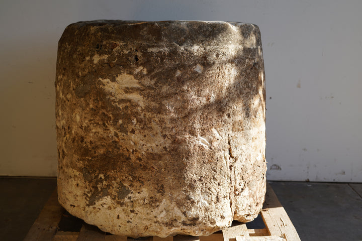 Antique Hand Carved Limestone Round Planter which can be converted into a beautiful fountain or fire pit. Dimensions: 32" H x 37" W. In partial sunlight