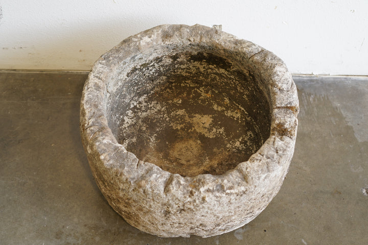 Top view of Antique Limestone Planter, hand-carved.

dimensions: 23" D x 15" H