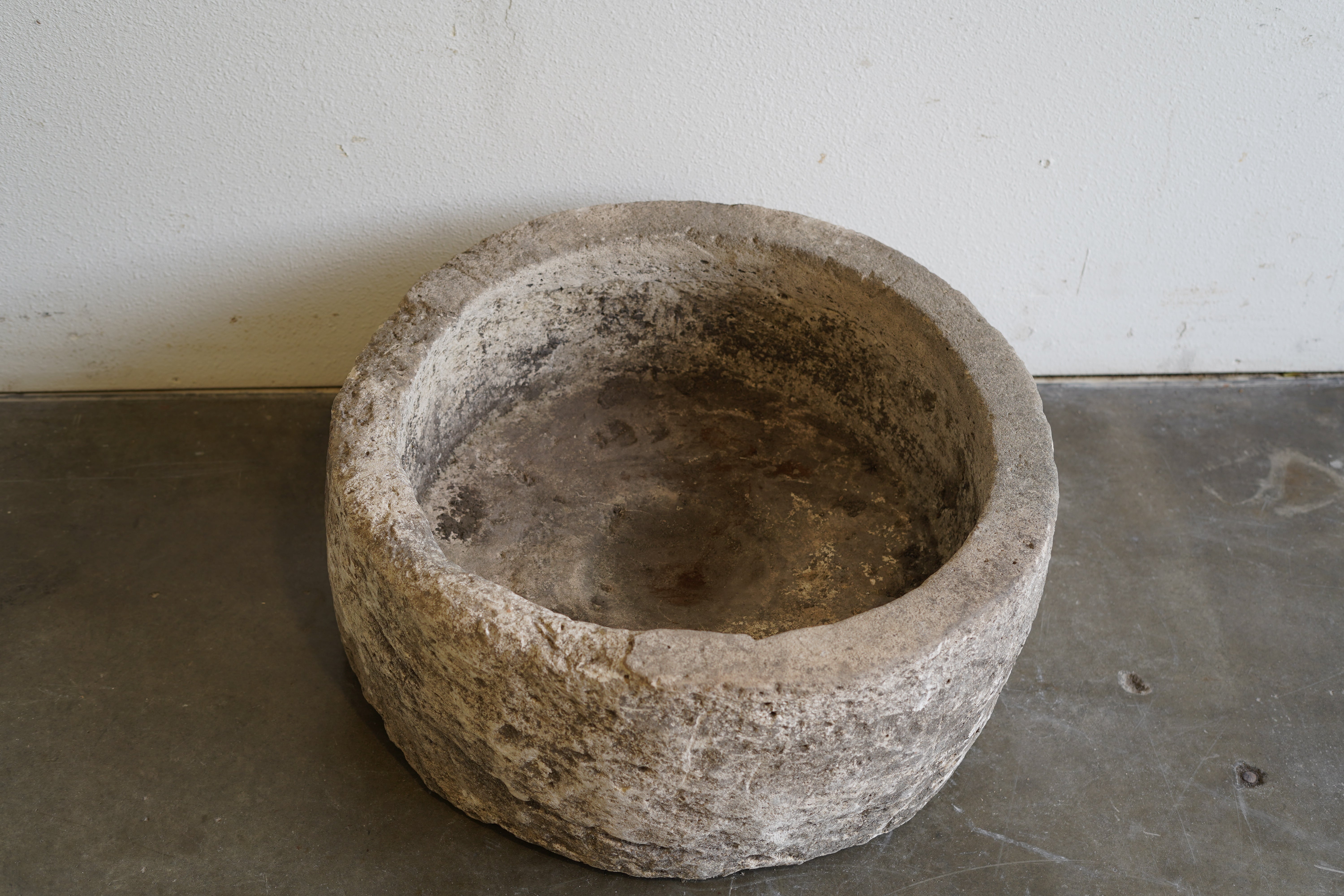 Top down view  of Antique Round Hand-carved Limestone planter

Dimensions: 27" D x 12" H