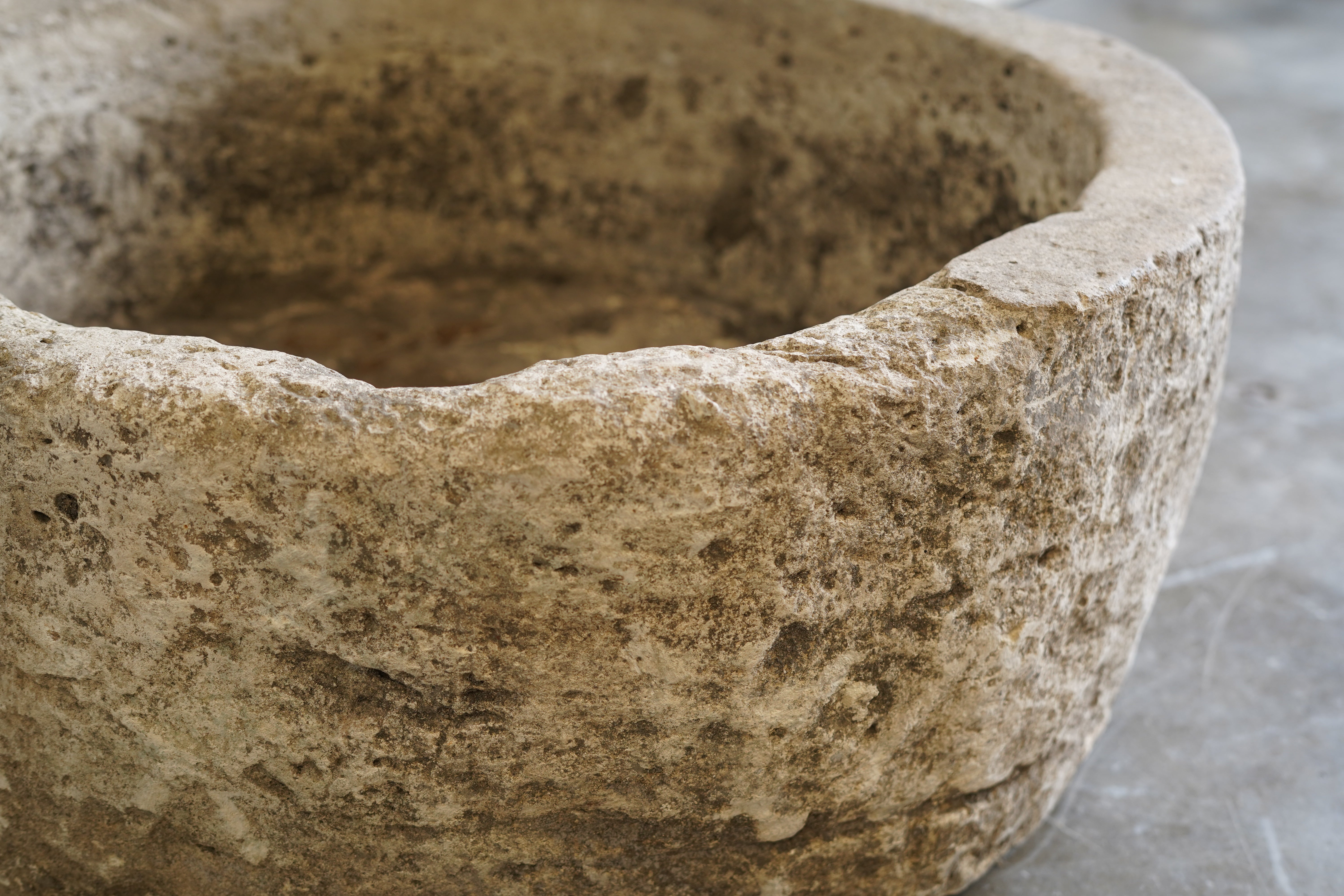 Close up view of Antique Round Hand-carved Limestone planter

Dimensions: 27" D x 12" H