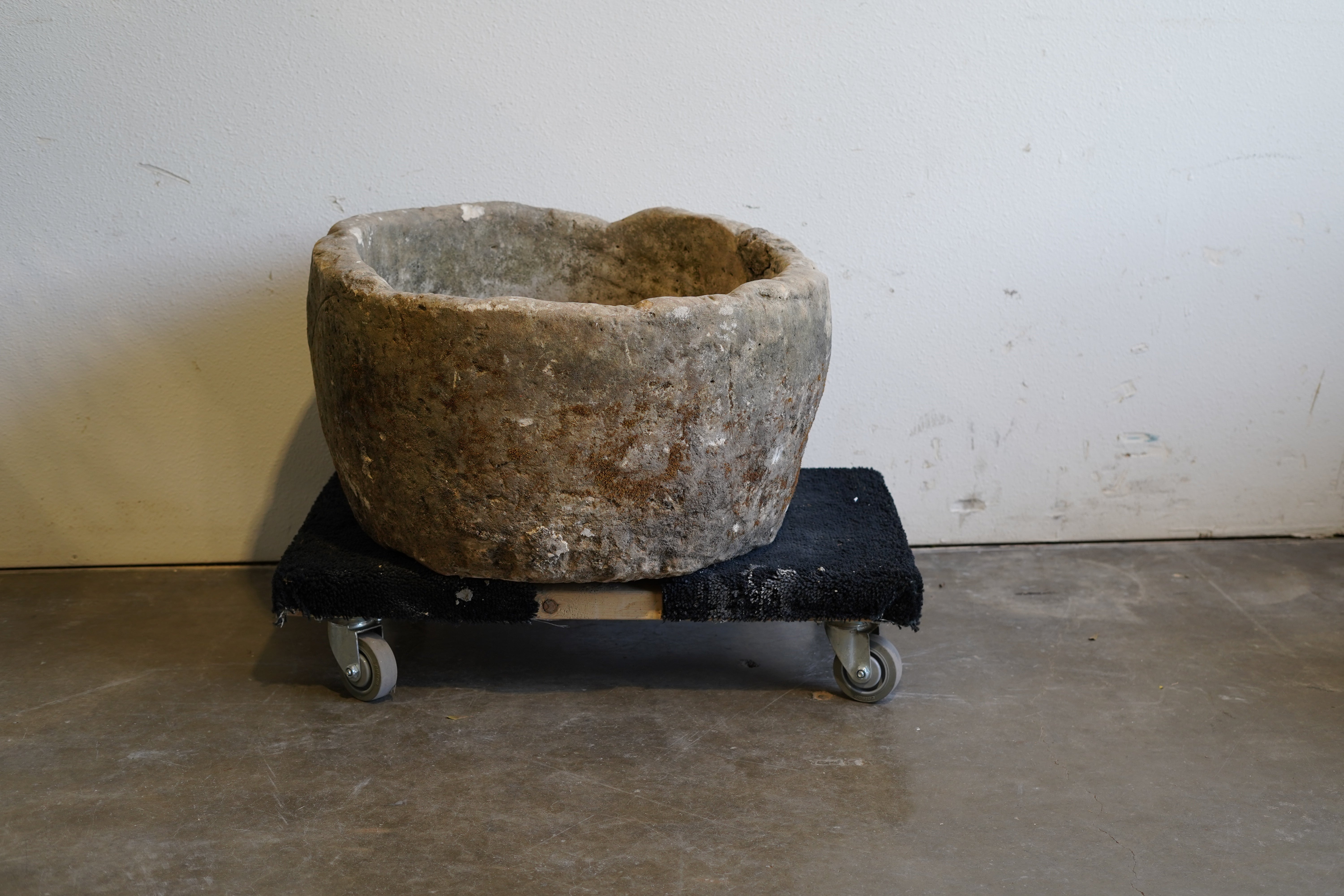 Backside of Antique Round Limestone Planter. 28" W x 17" H. Can be converted to fountain or fire pit. hand-carved, authentic limestone. Natural aging and patina for decades of use.