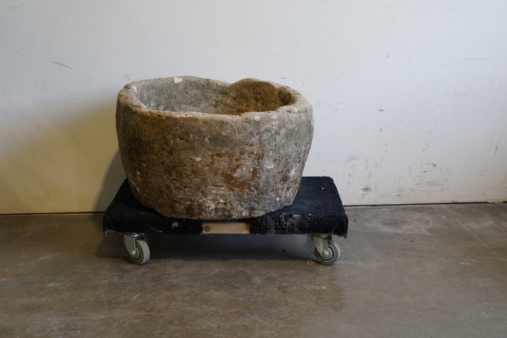 Backside of Antique Round Limestone Planter. 28" W x 17" H. Can be converted to fountain or fire pit. hand-carved, authentic limestone. Natural aging and patina for decades of use.