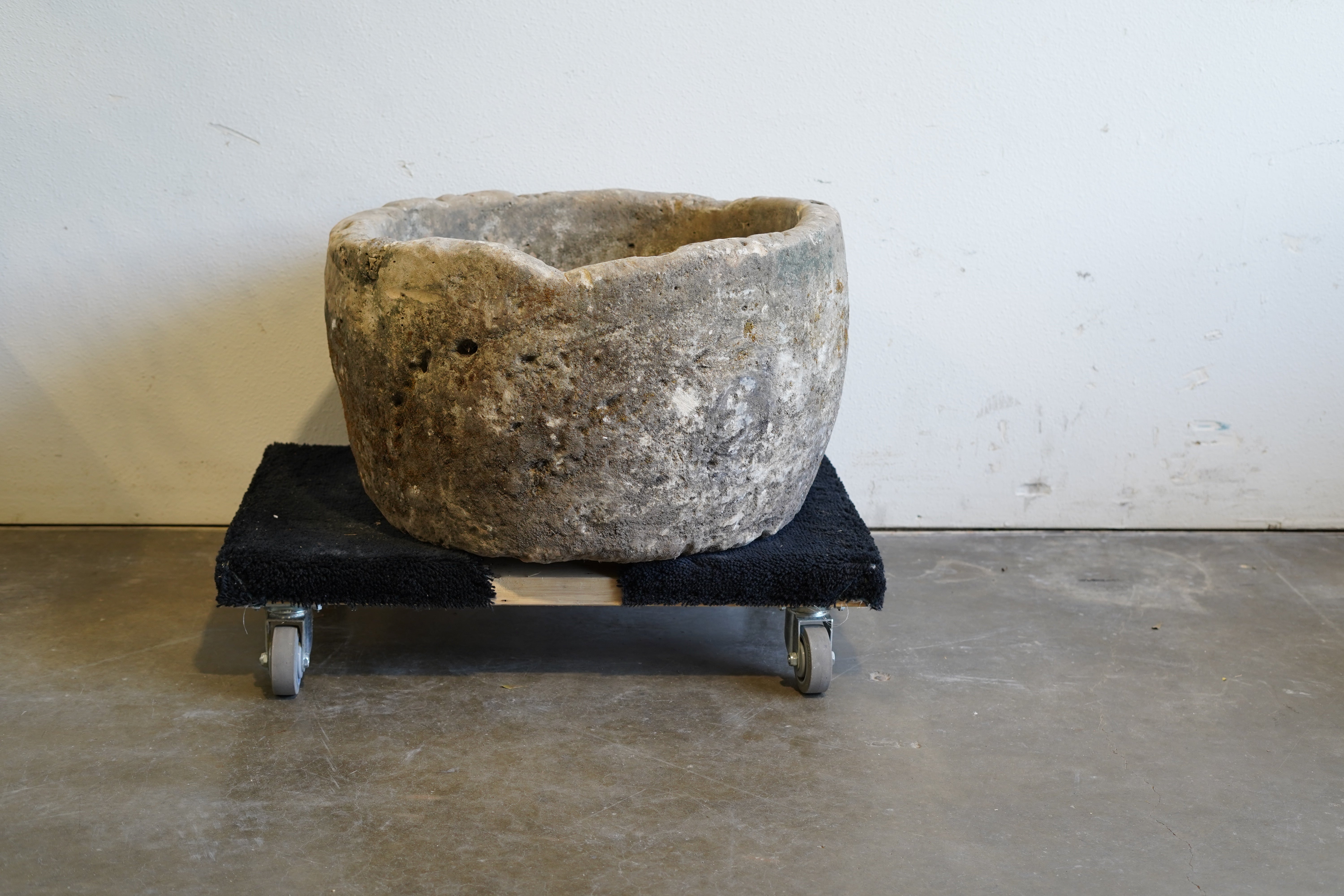 Rustic Antique Round Limestone Planter. 28" W x 17" H. Can be converted to fountain or fire pit. hand-carved, authentic limestone. Indirect lighting.