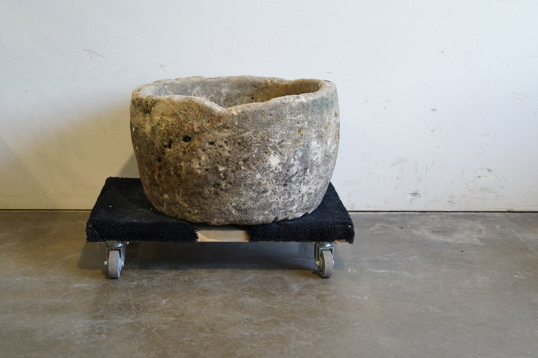 Rustic Antique Round Limestone Planter. 28" W x 17" H. Can be converted to fountain or fire pit. hand-carved, authentic limestone. Indirect lighting.