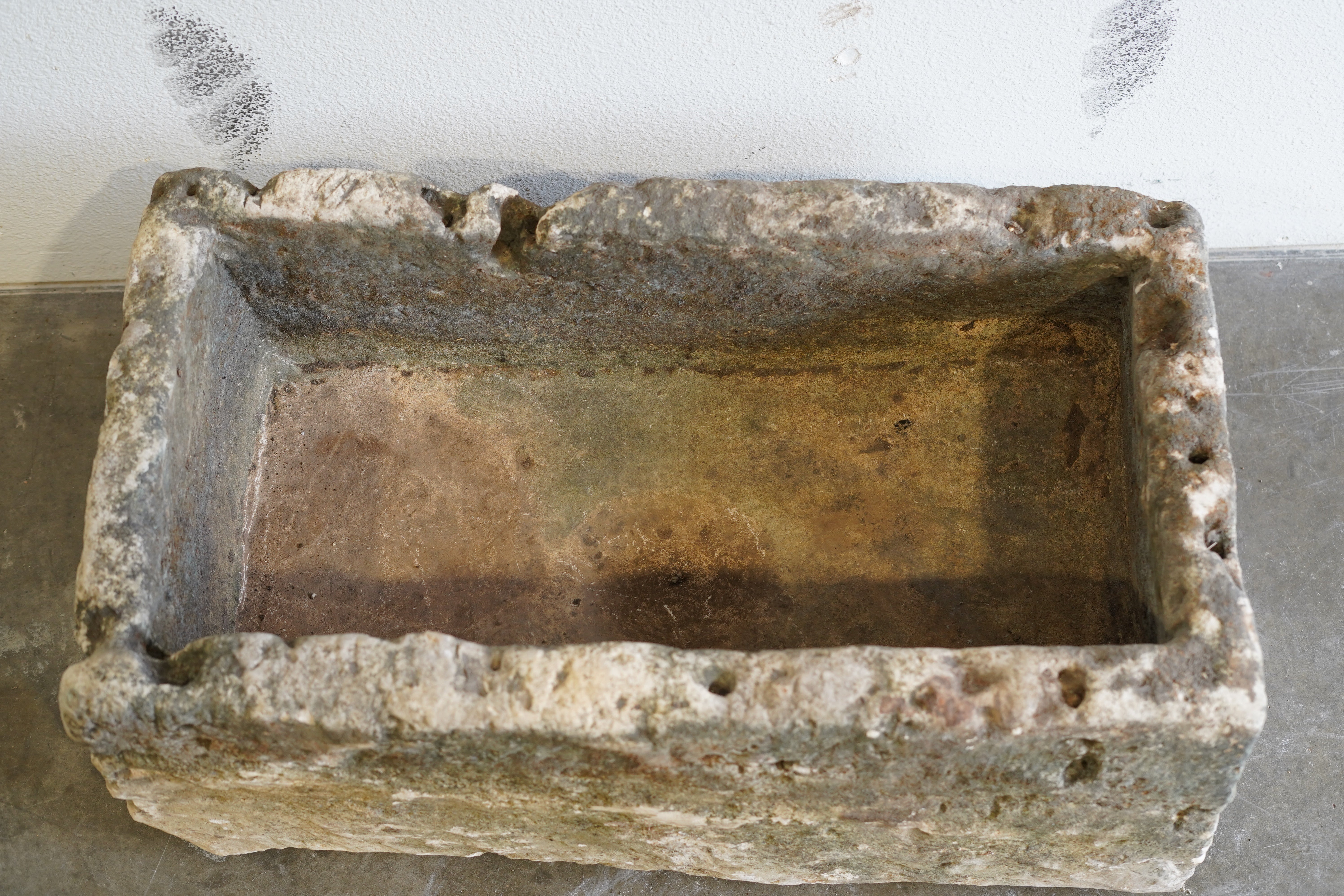 Top View of Antique Limestone Trough

Hand-Carved, Authentic Limestone

Dimensions: 29" L x 16" W x 13" H

Natural Patina, Aging over centuries, character.