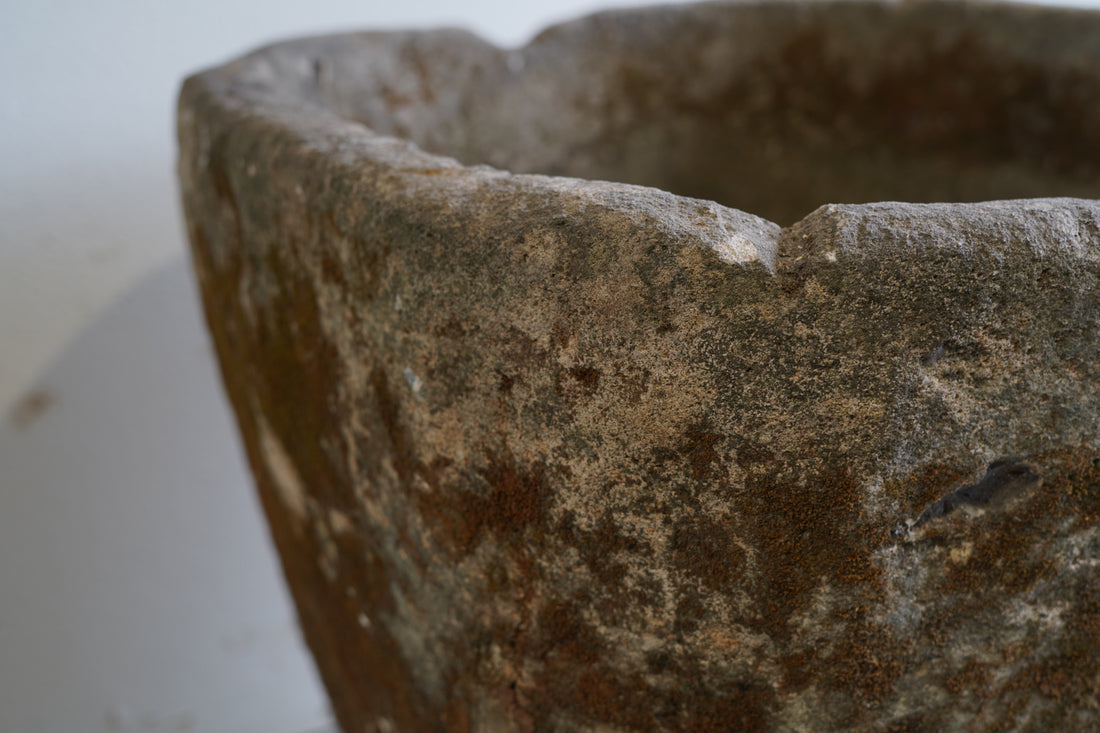 Close up of natural patina on authentic limestone planter