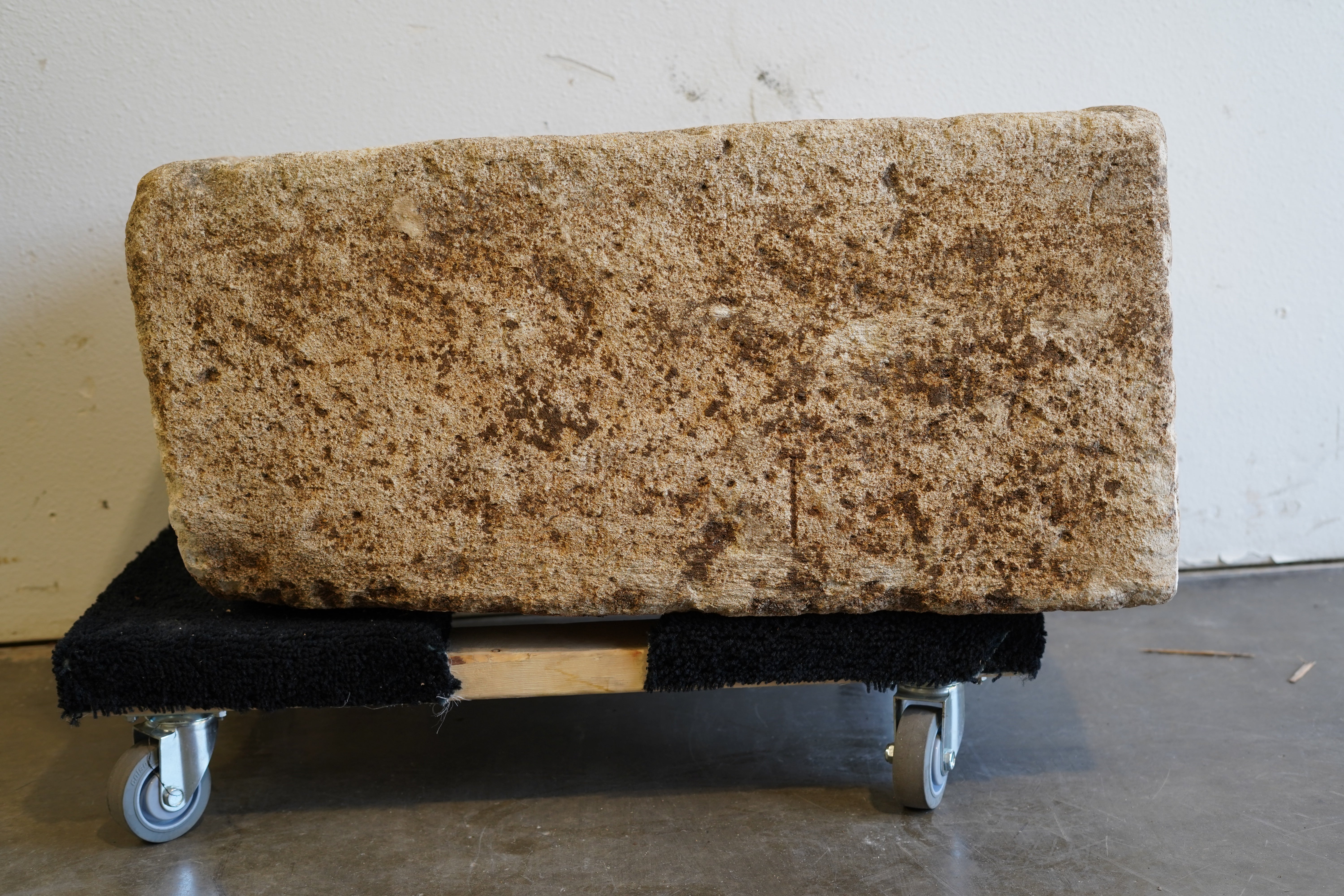 Front view of antique limestone trough with natural patina and aging.