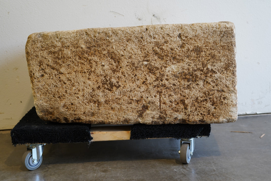 Front view of antique limestone trough with natural patina and aging.