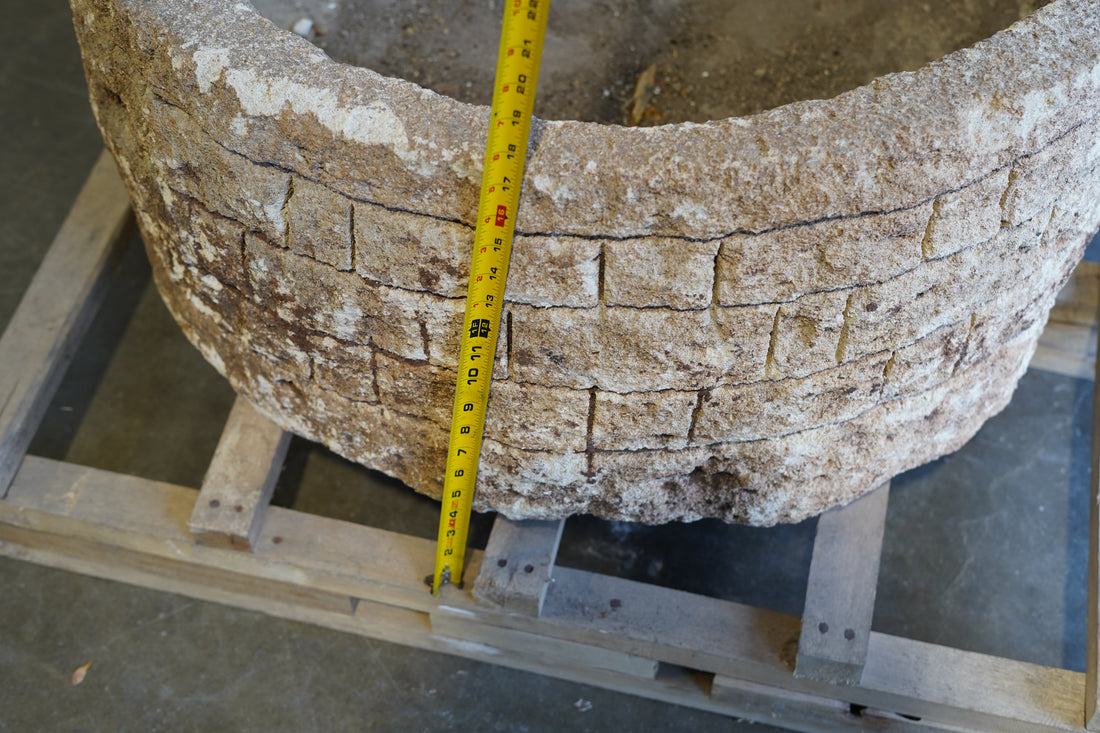 Close up side view of Antique LImestone Planter with hand-carvings on the outside and natural patina