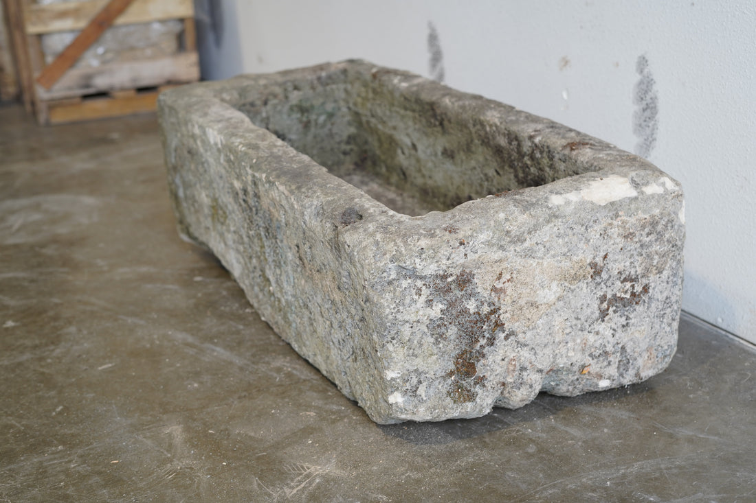 Side view of Antique Limestone Trough

Very Rare

Hand-carved, authentic limestone planter

37" L x 17" W x 13" H