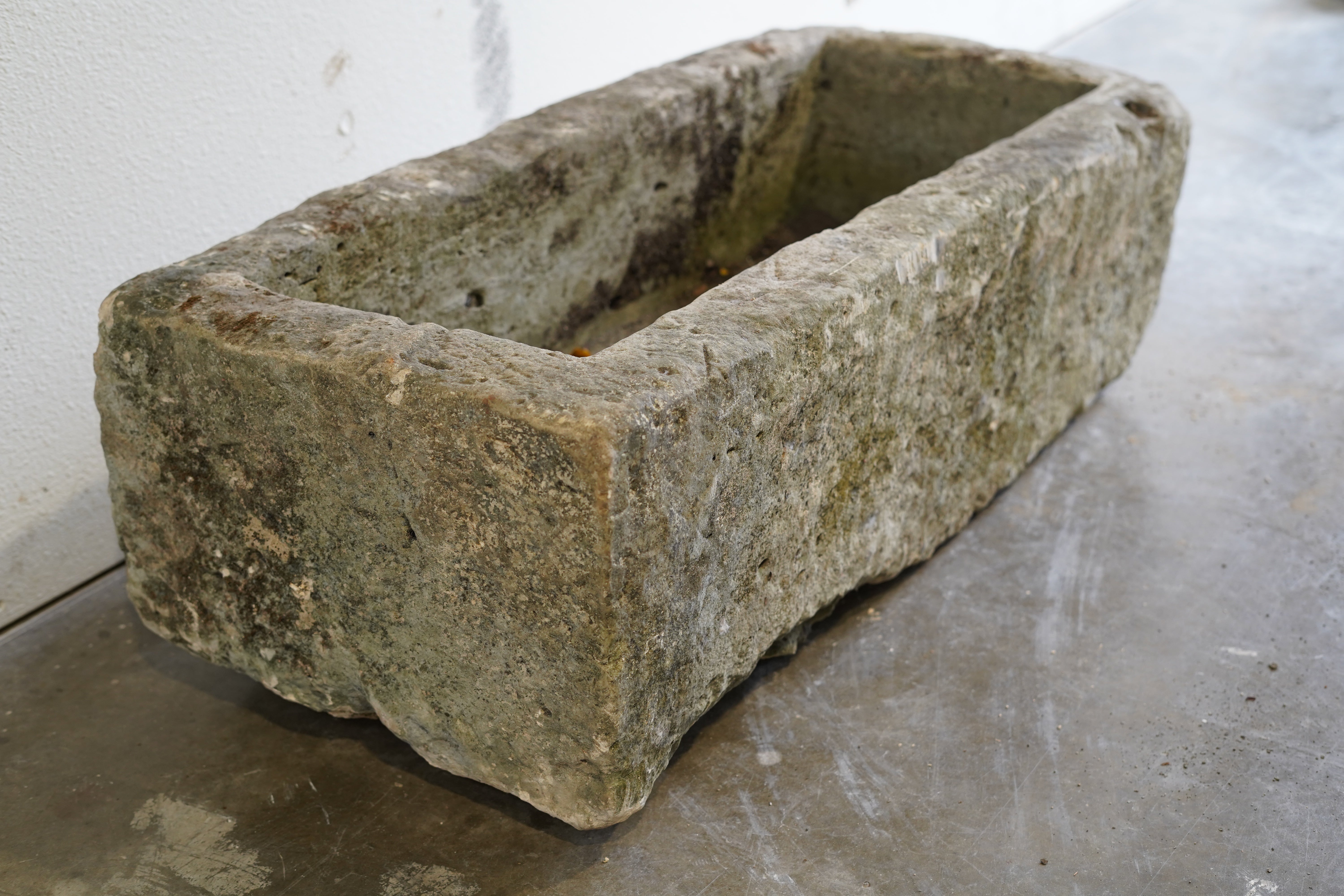 Alternate side view of Antique Limestone Trough

Very Rare

Hand-carved, authentic limestone planter

37" L x 17" W x 13" H