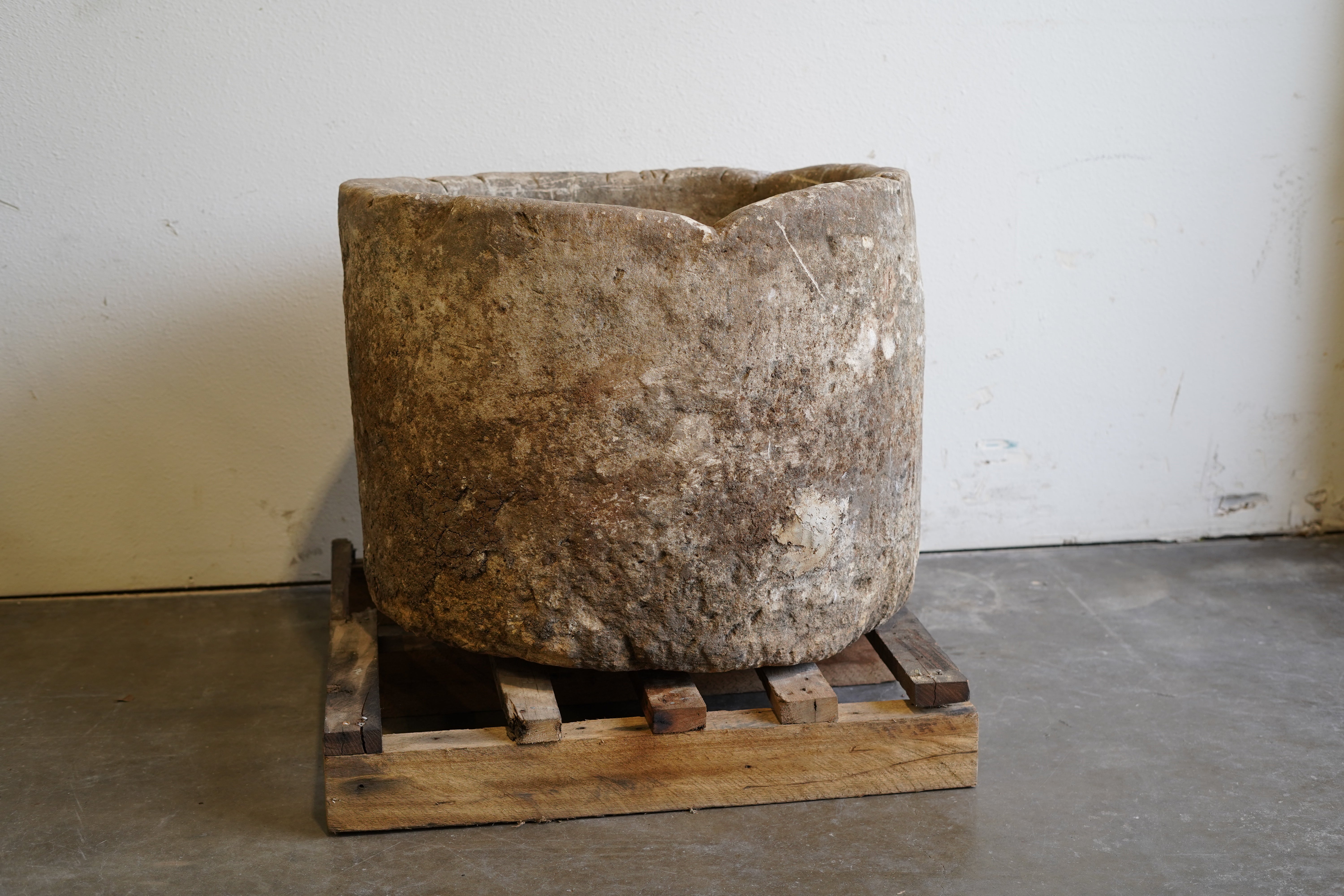 uneven edge of limestone planter