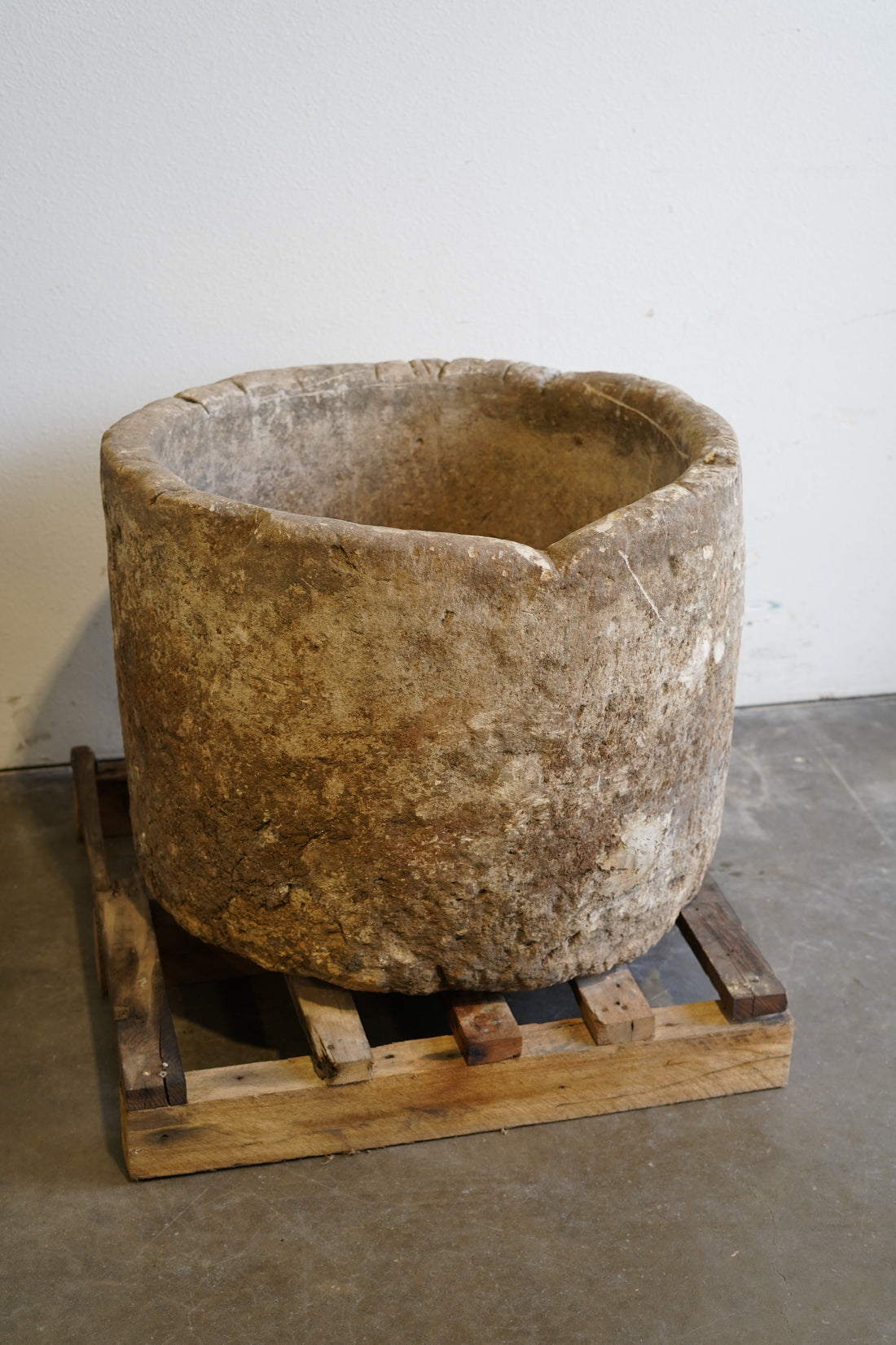 back view of antique limestone planter