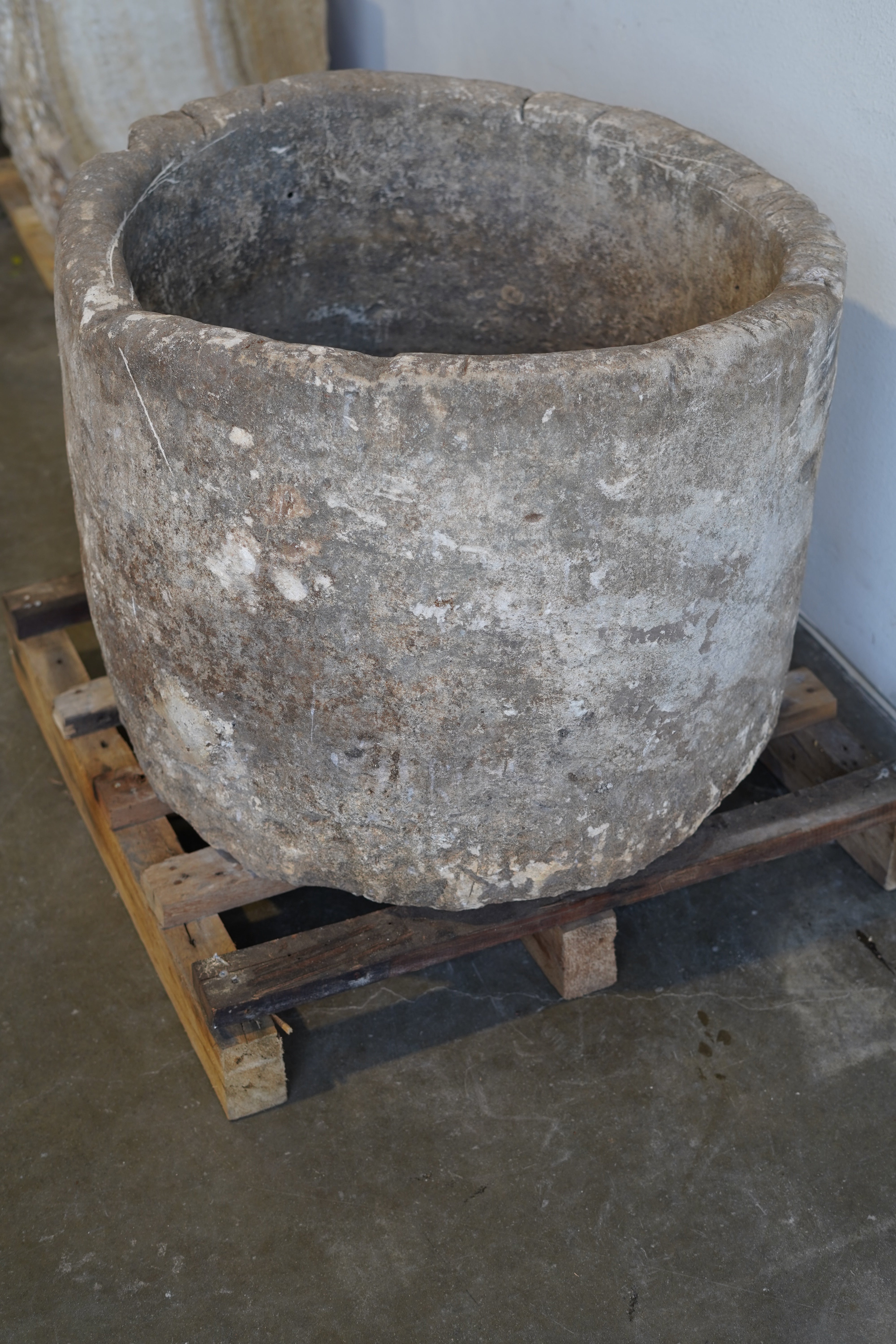 Side view of antique limestone planter