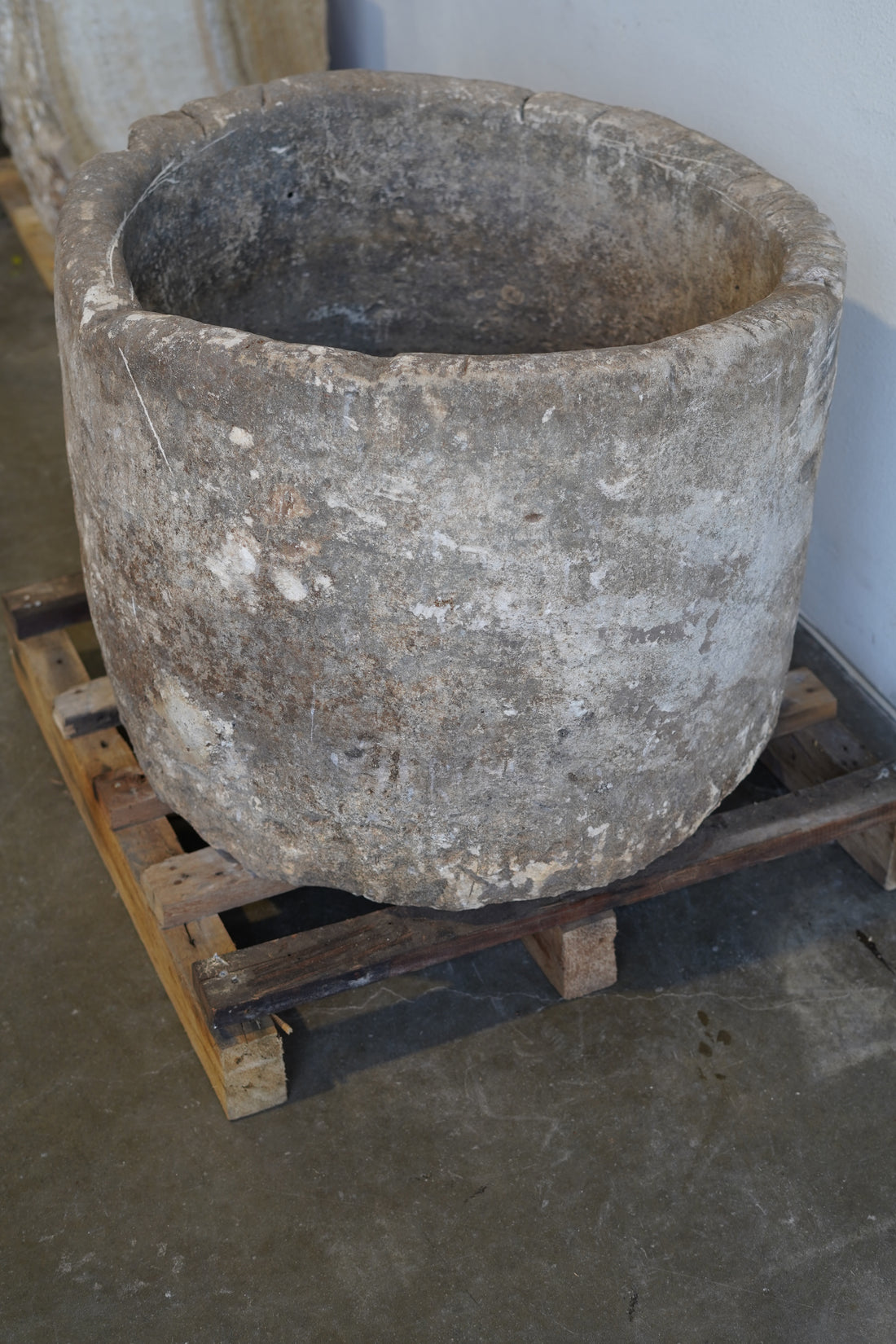 Side view of antique limestone planter