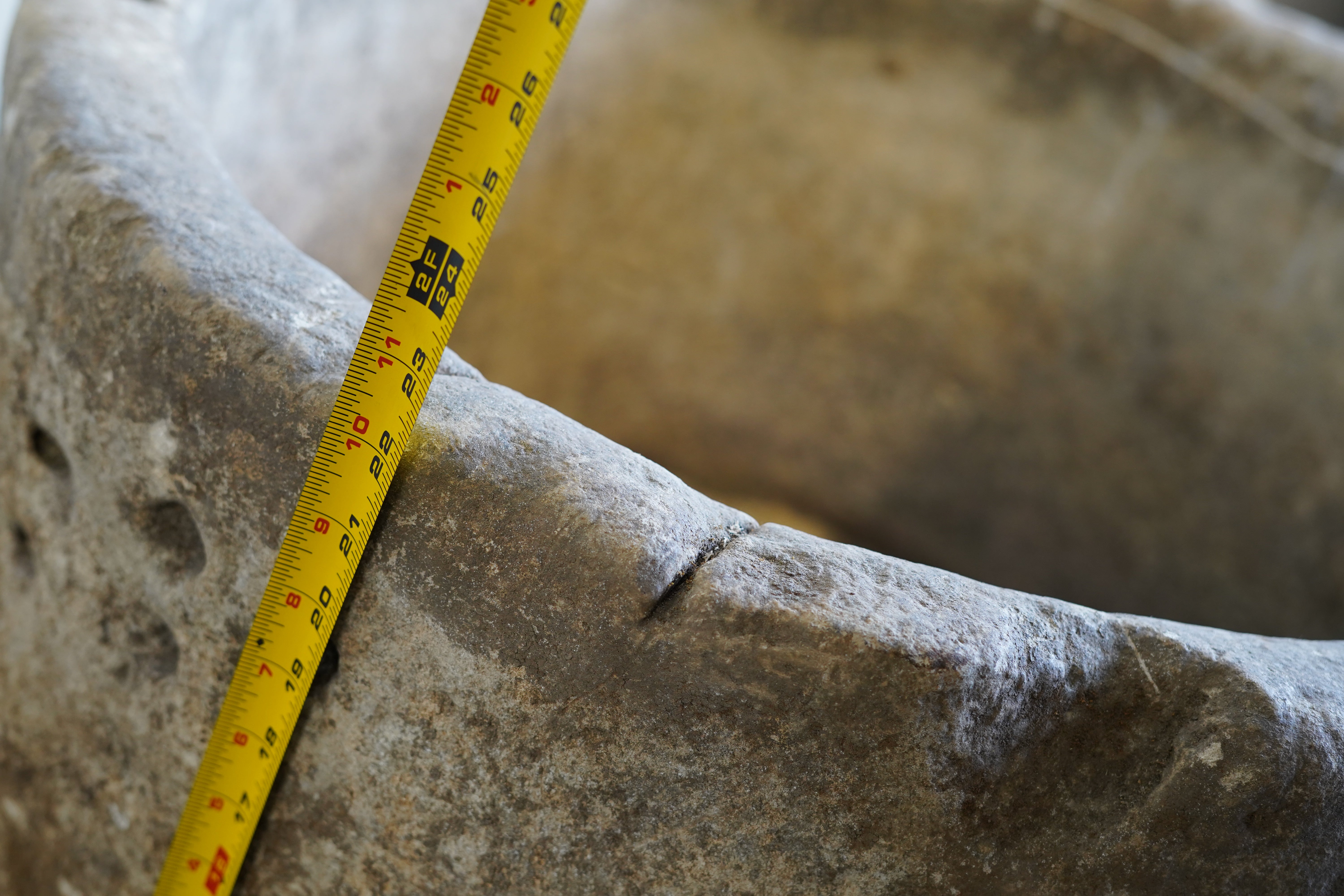 close up of lip of antique limestone planter