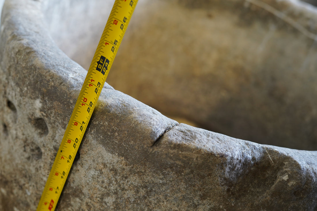 close up of lip of antique limestone planter
