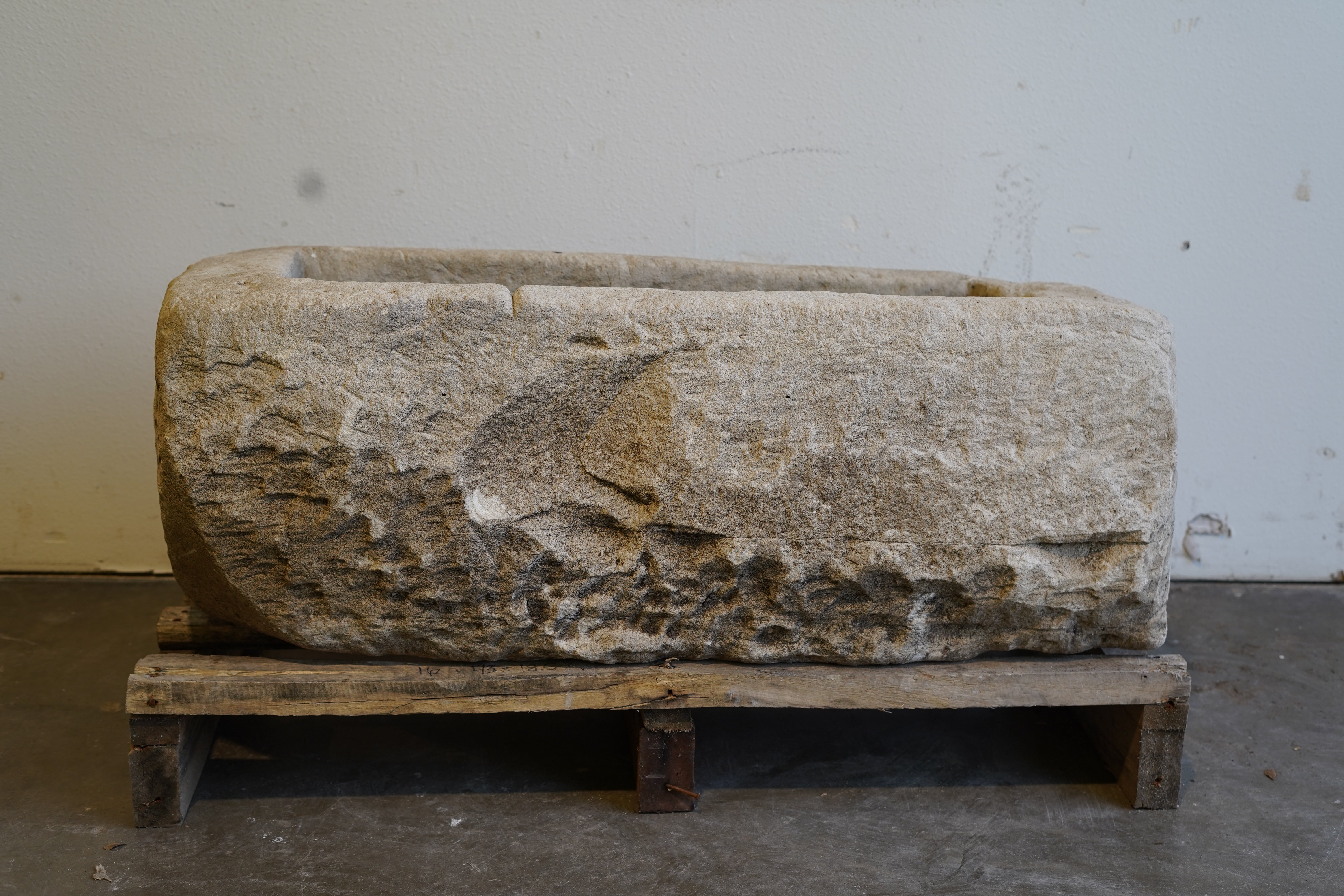 Antique limestone planter trough front view with natural weathered patina, 43 inches long