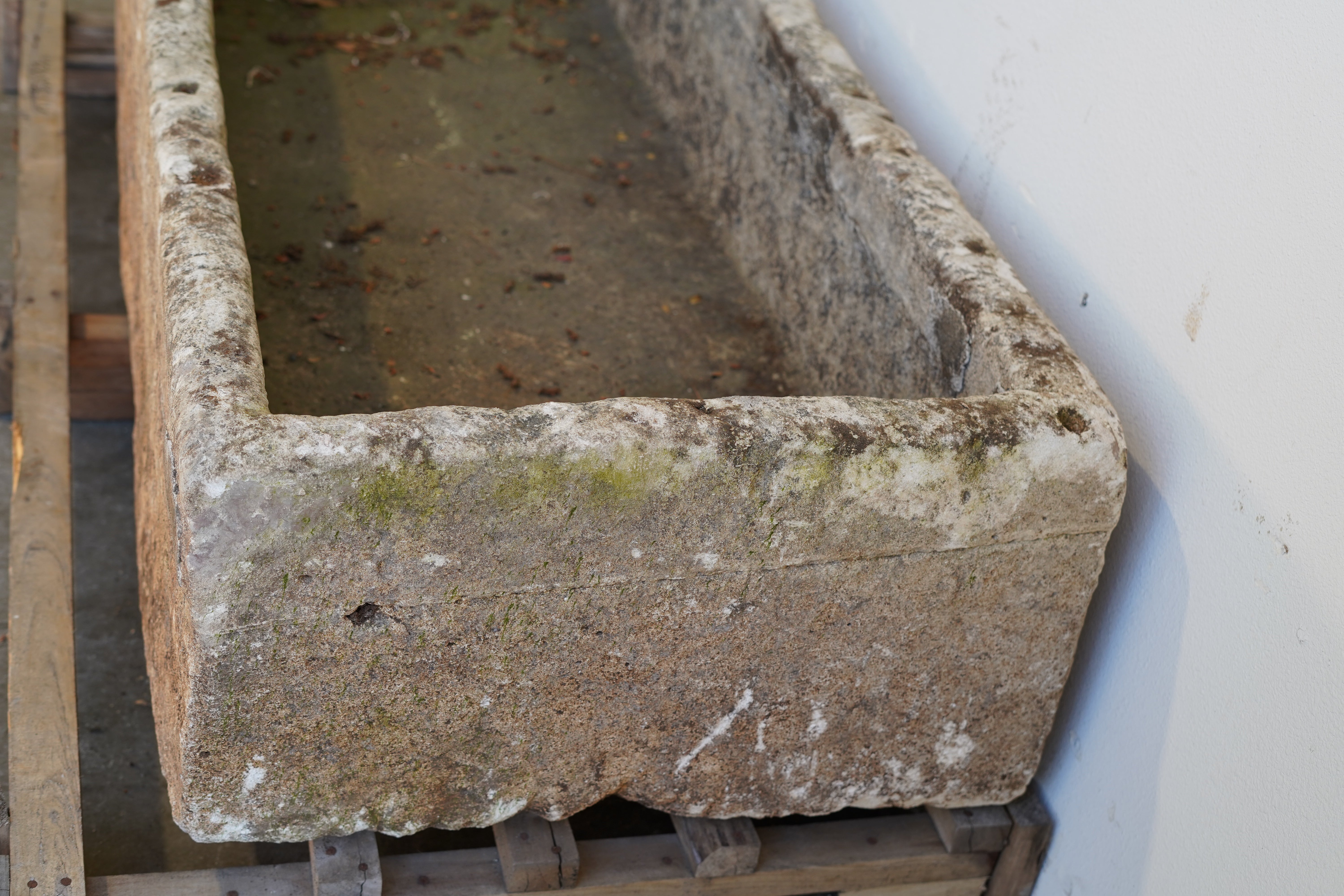 side view of Rectangular Authentic Antique Limestone Trough Planter which can be converted into fountain or fire pit. 66" L x 28" W x 16" H