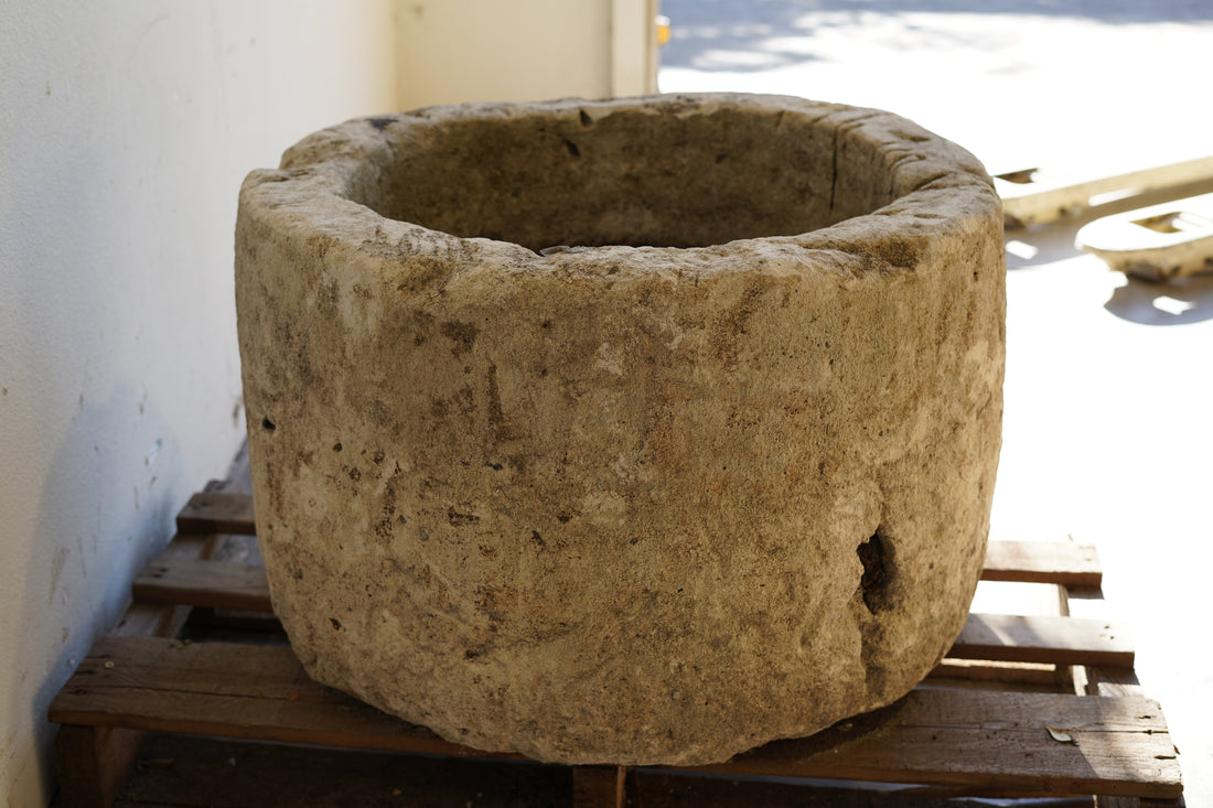 side view of Antique Limestone Planter - Round. Dimensions: 18" H x 28" W