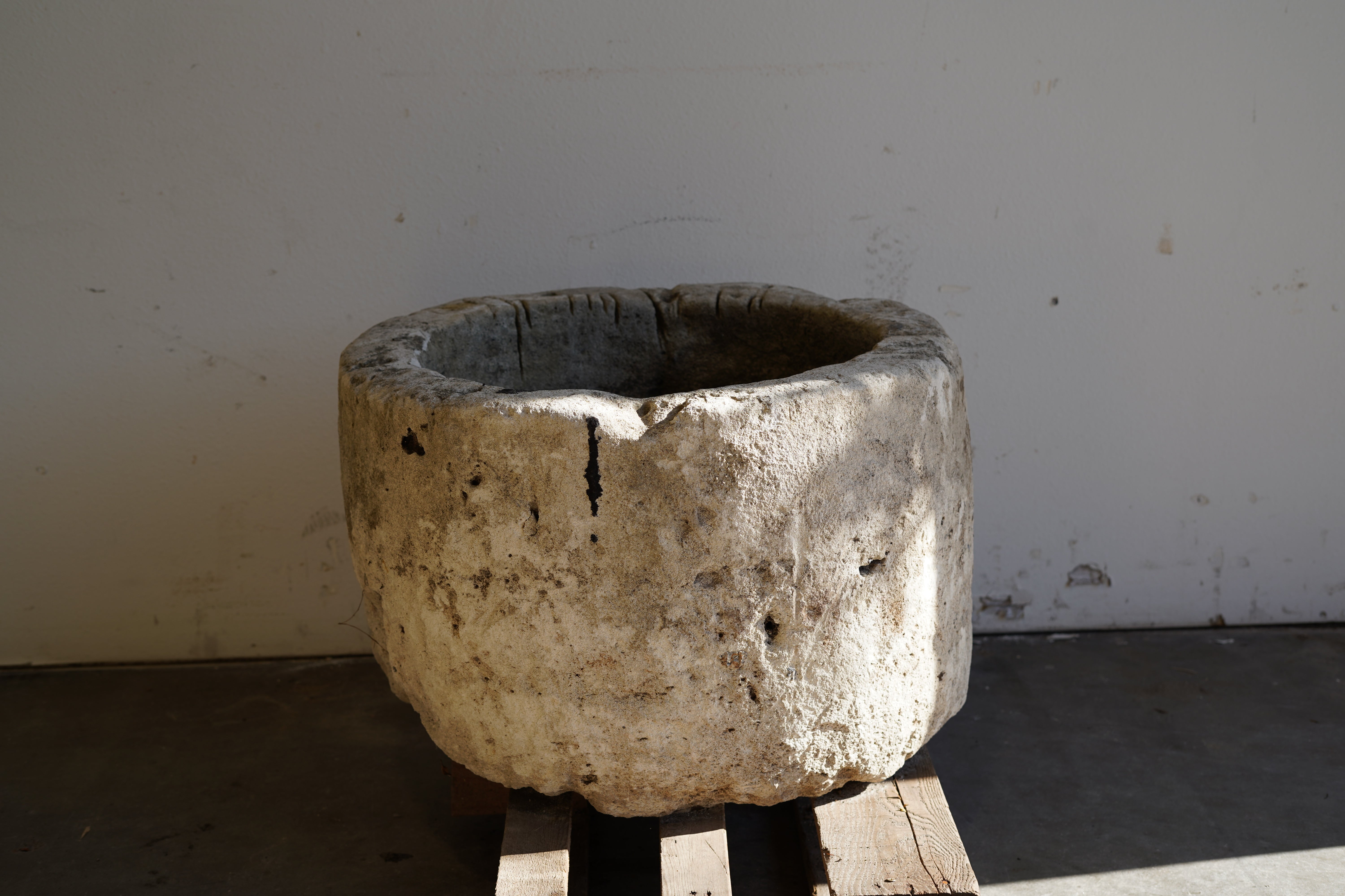 Antique Limestone Planter - Round. Dimensions: 18" H x 28" W