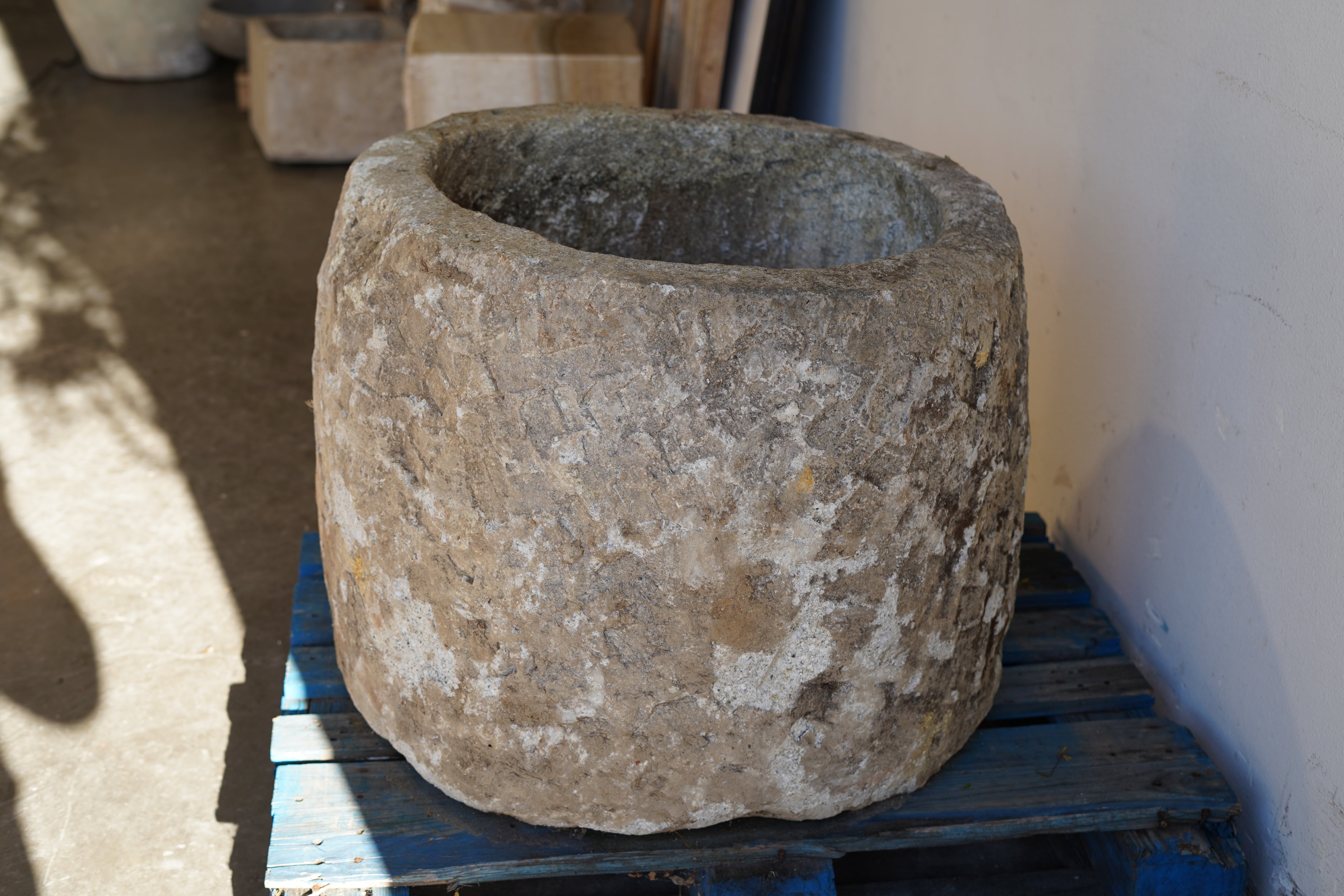 Side view of Antique Hand Carved Limestone Planter 25" H x 29" D with natural patina and beautiful aging.