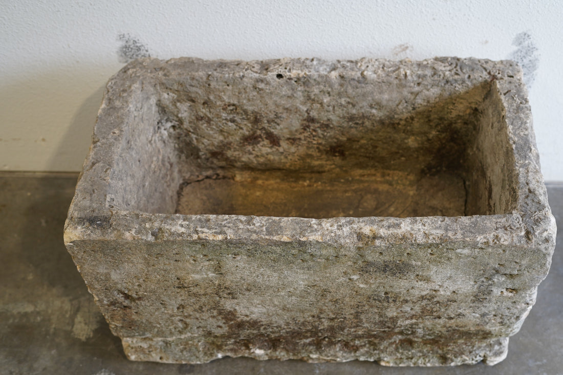 too down view of authentic limestone trough. Hand-carved, century old, authentic limestone.