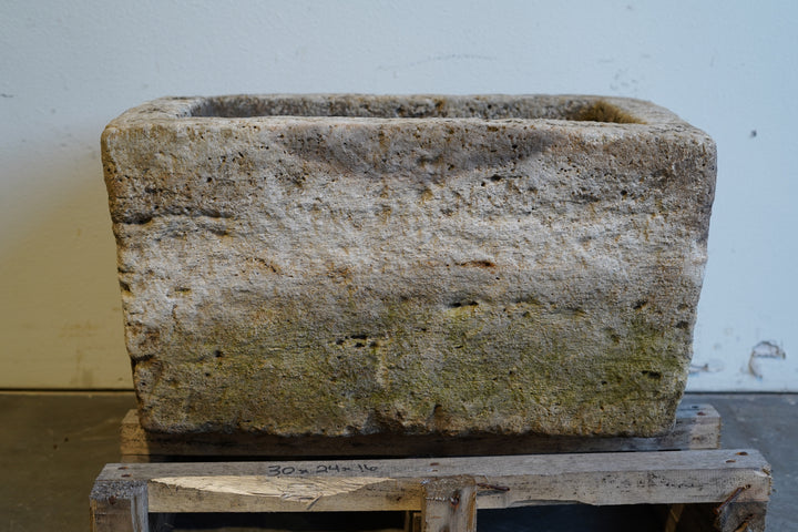 Antique limestone trough planter with aged patina, hand-carved rectangular design measuring 30L x 24W x 16H inches, perfect for rustic gardens or farmhouse-style interiors.