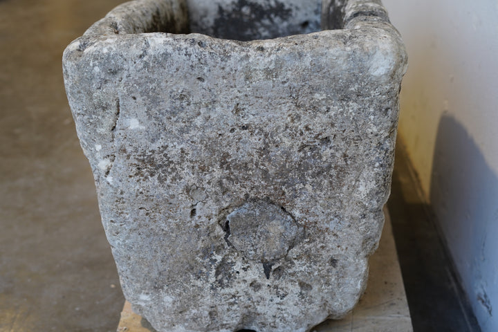 Front view of antique limestone trough planter with natural patina and weathered texture