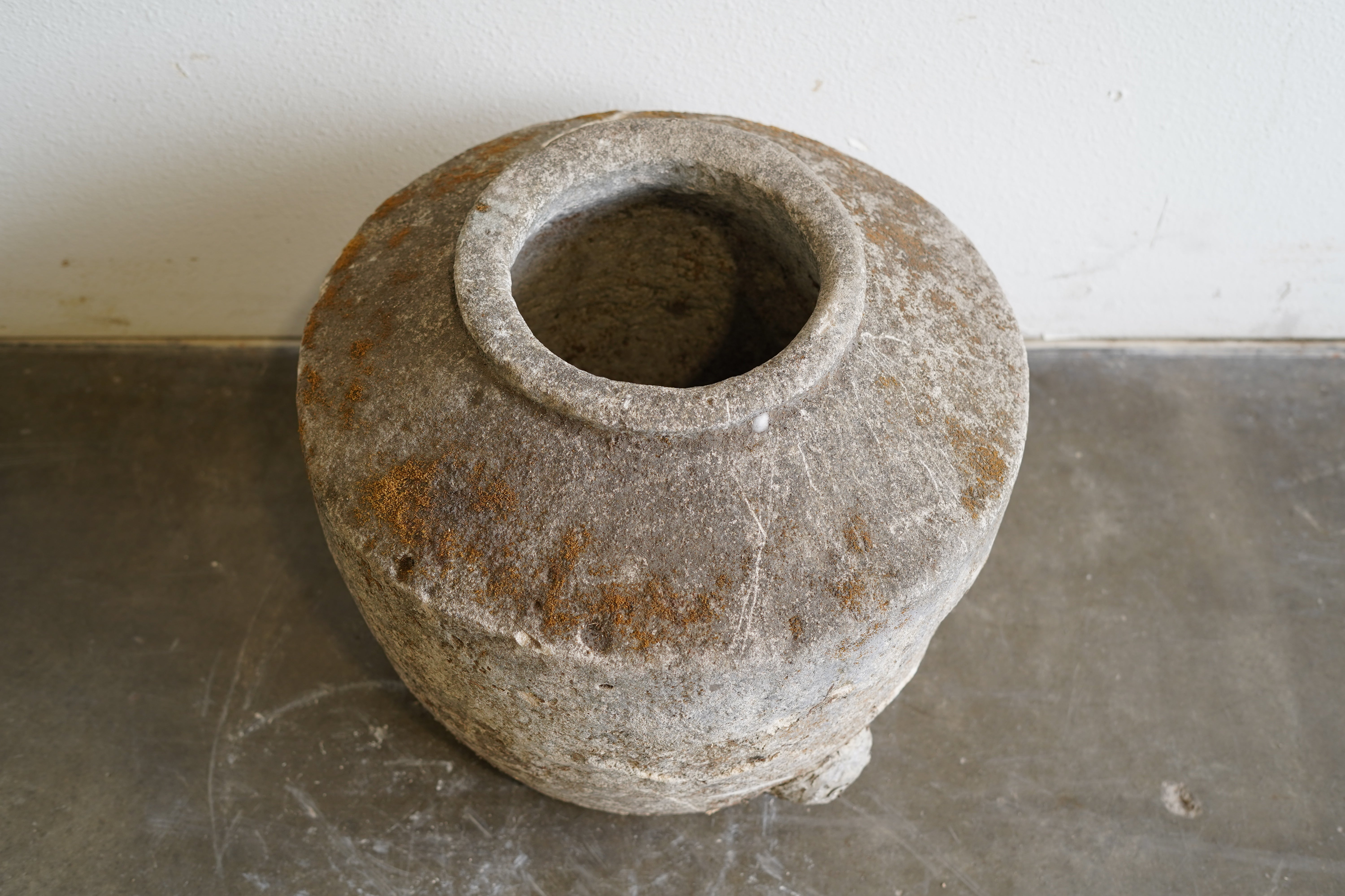 Top down view of Antique Limestone in Jug Shape

Dimensions: 21" W x 18" H with approx 7" mouth