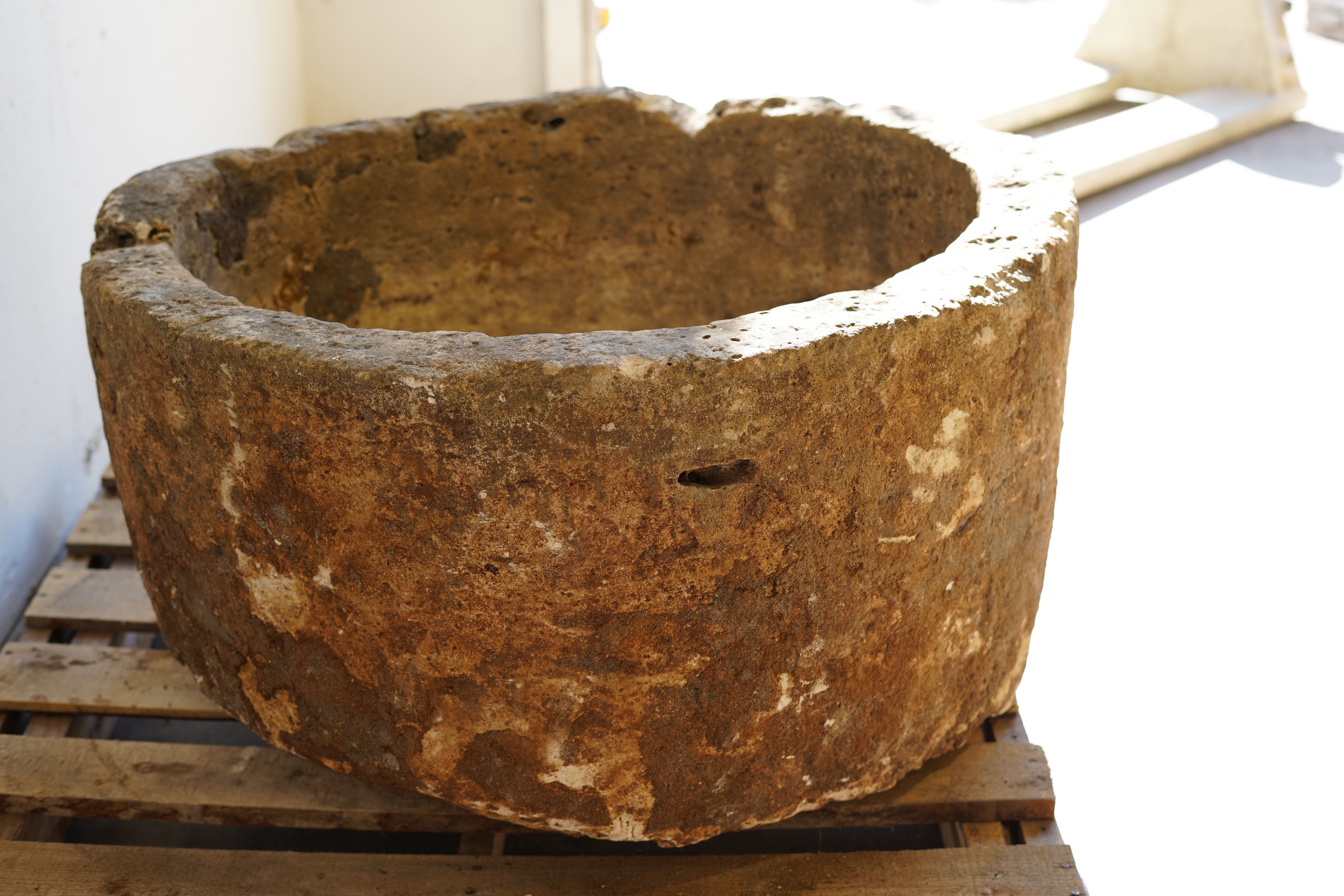 Antique Round Hand-Carved limestone with natural patina and aging over decades. Dimensions: 17" H x 33" W