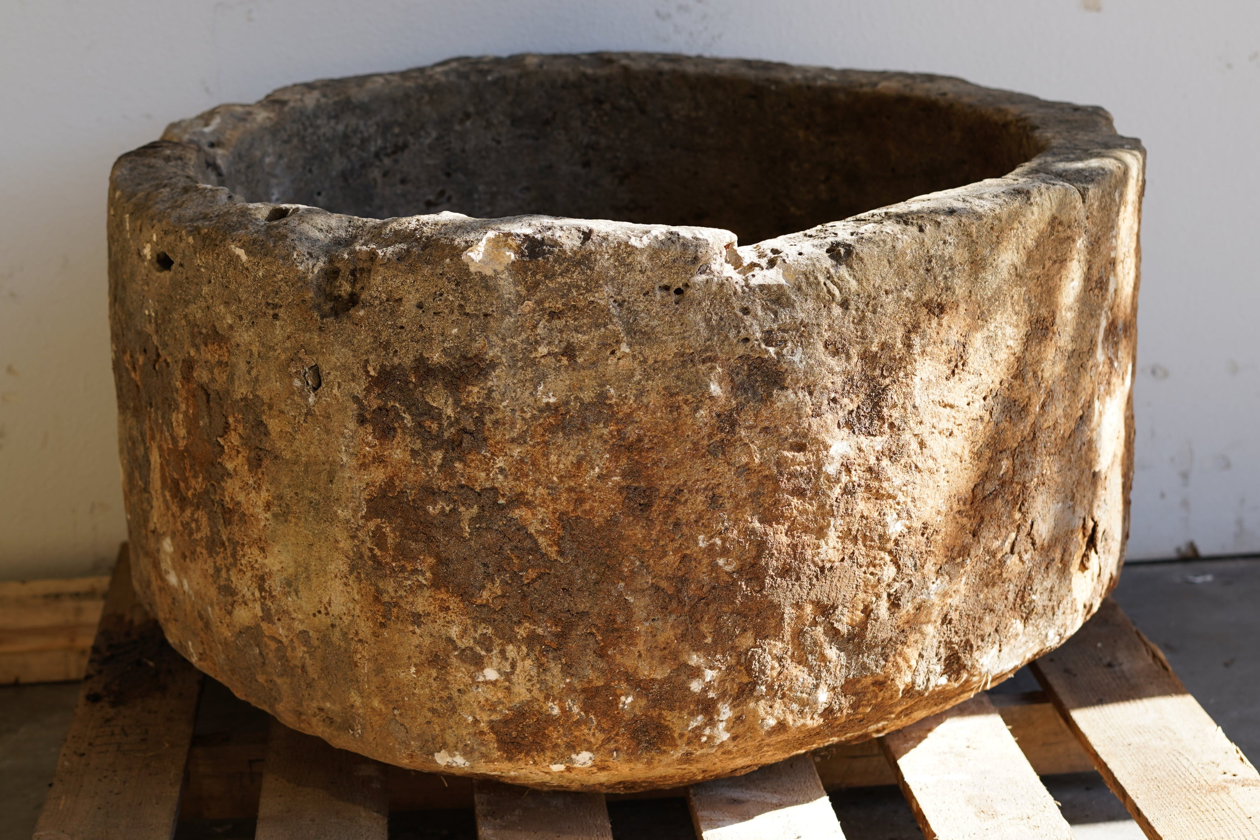 Antique Round Hand-Carved limestone with natural patina and aging over decades. Dimensions: 17" H x 33" W