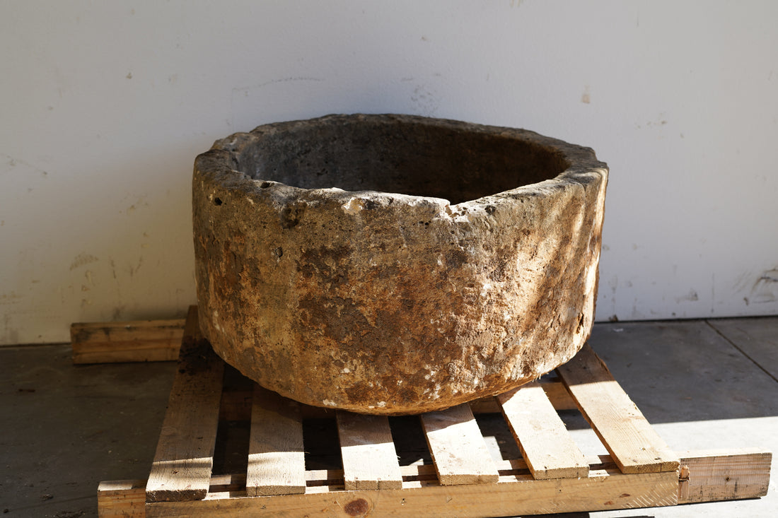 Front View of Antique Round Hand-Carved limestone with natural patina and aging over decades. Dimensions: 17" H x 33" W