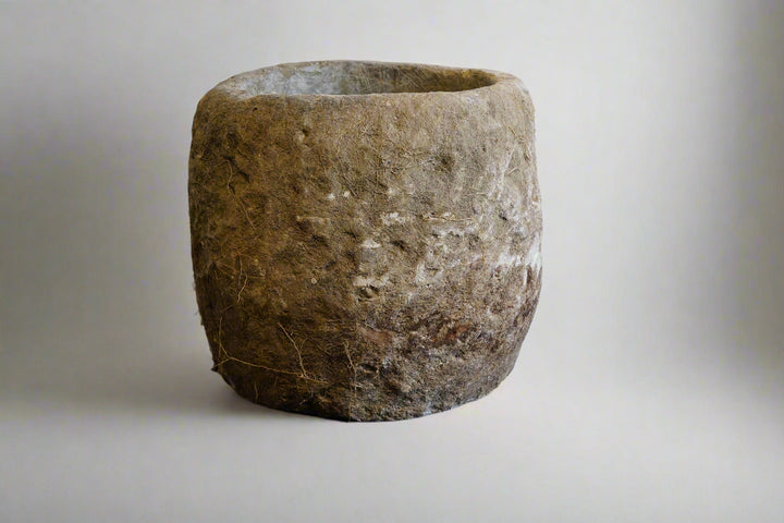 Antique Limestone Planter on white backdrop. Dimensions are 24" H x 24" W