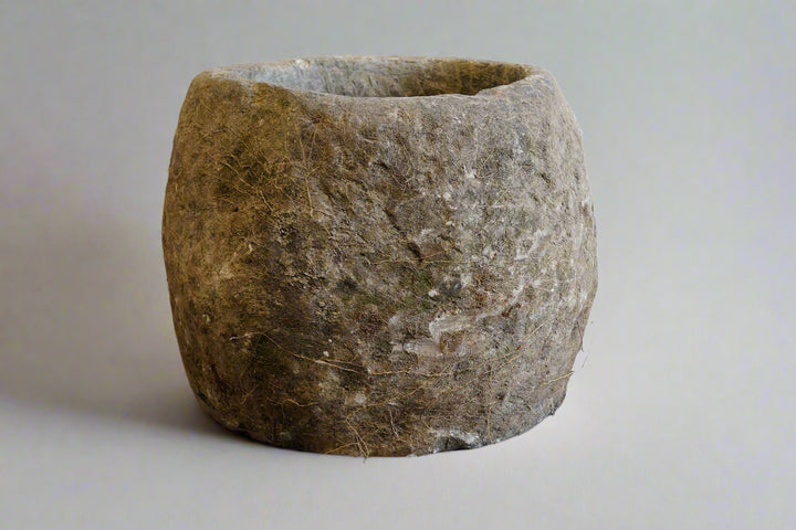 Antique Limestone Planter on white backdrop. Dimensions are 24" H x 24" W