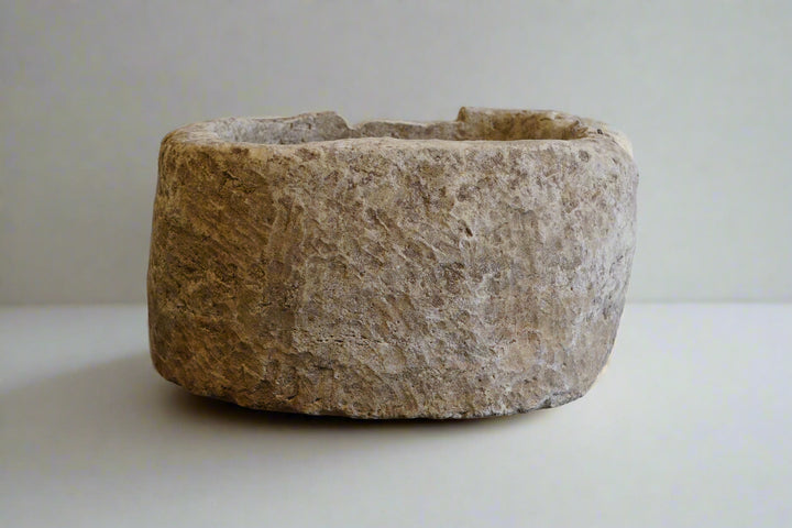One of a kind, antique, authentic, hand-carved, round, limestone planter. 32" W x 17" H. Plain white background