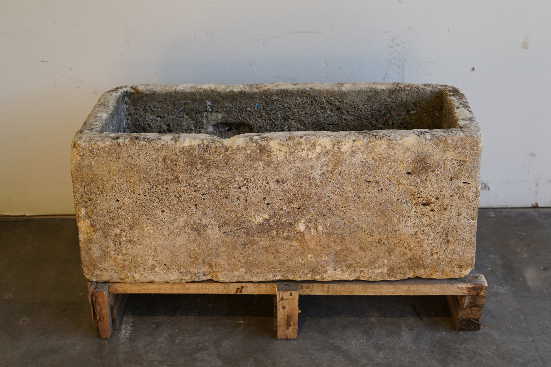 Front view of Antique Authentic Limestone Rectangular Square Planter 40" L x 17" W x 16" H with natural Patina in indoor lighting/shade.