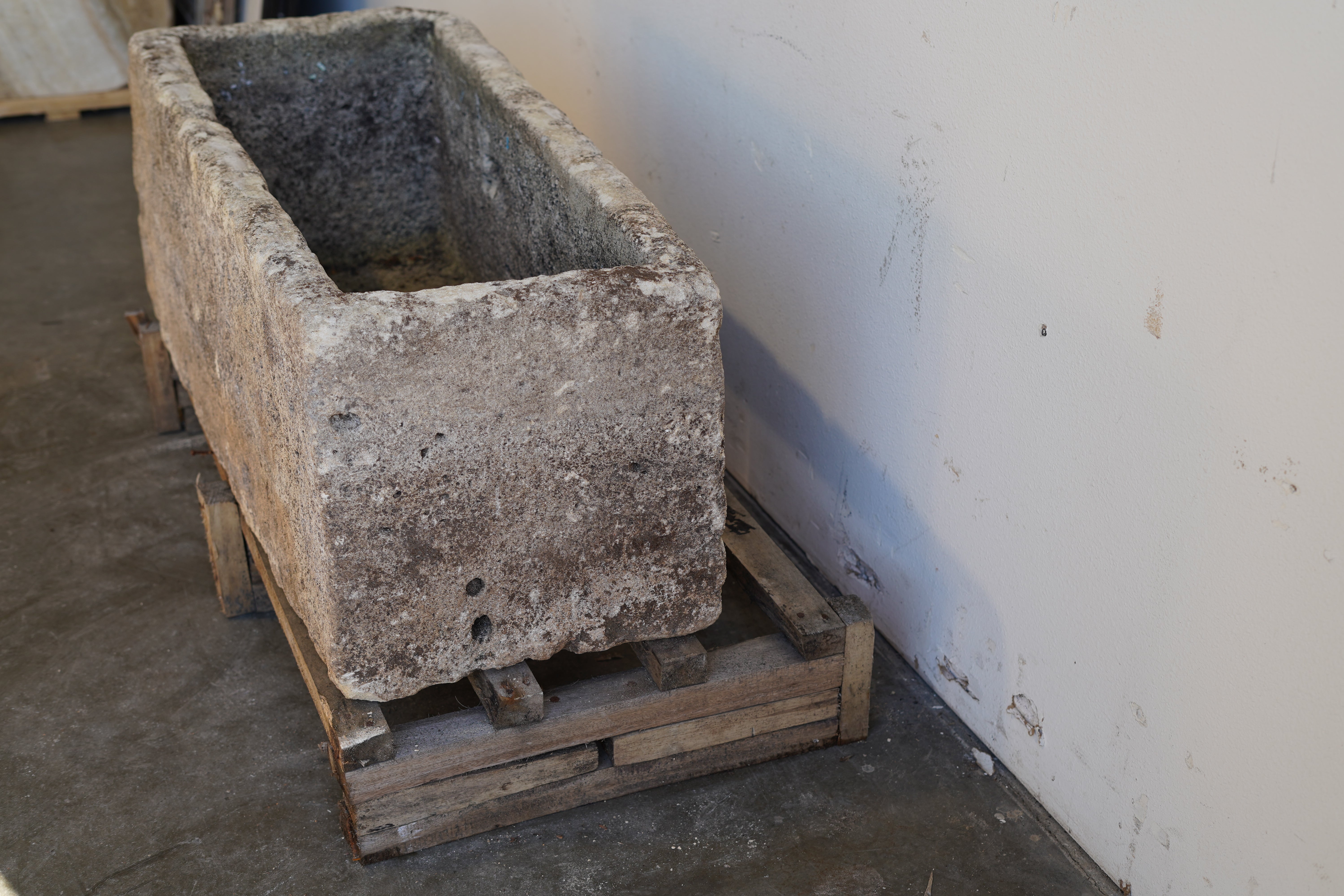 side view of Antique Authentic Limestone Rectangular Square Planter 40" L x 17" W x 16" H with natural Patina in indoor lighting.
