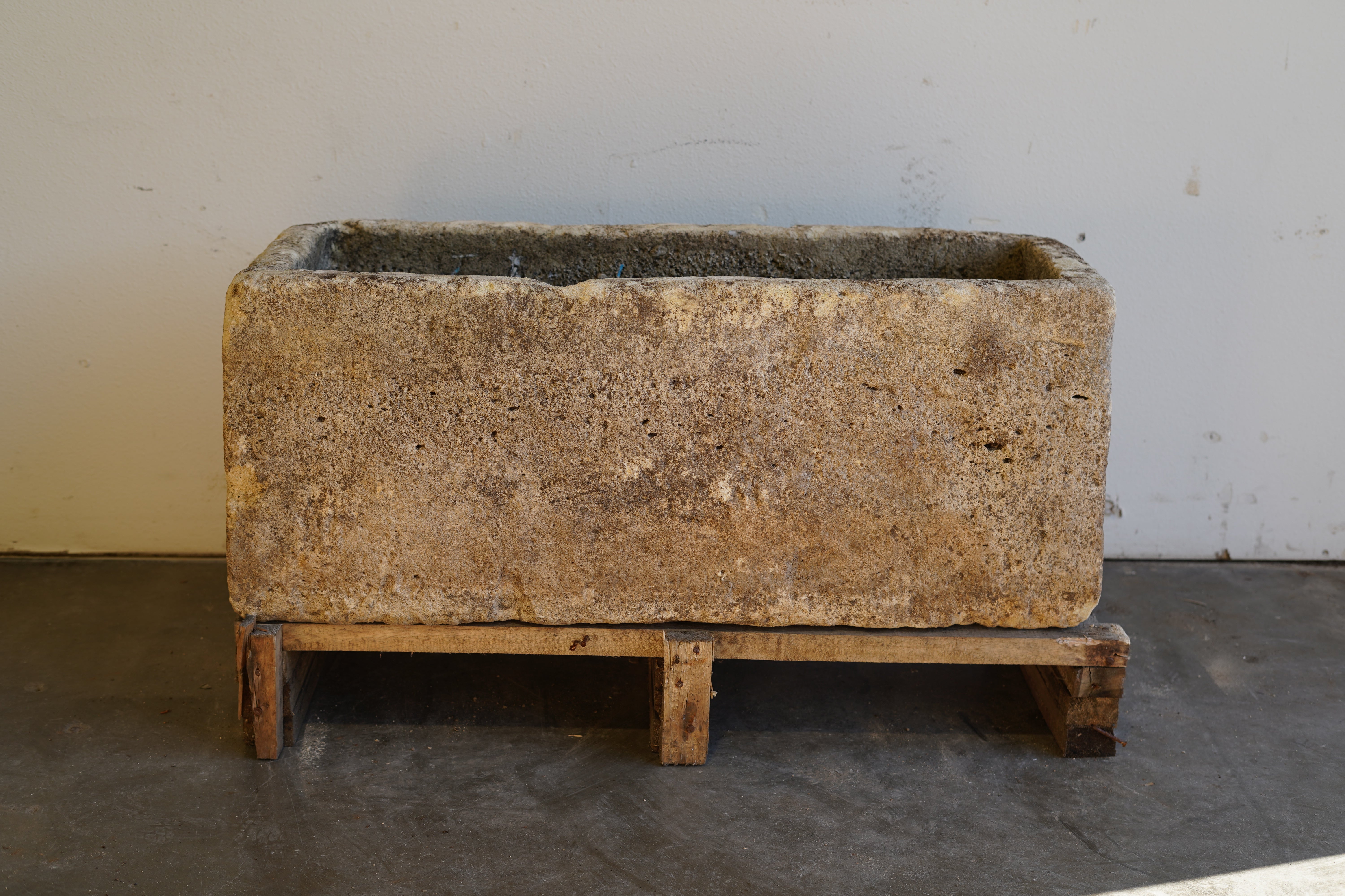 Front view of Antique Authentic Limestone Rectangular Square Planter 40" L x 17" W x 16" H with natural Patina in indoor lighting.