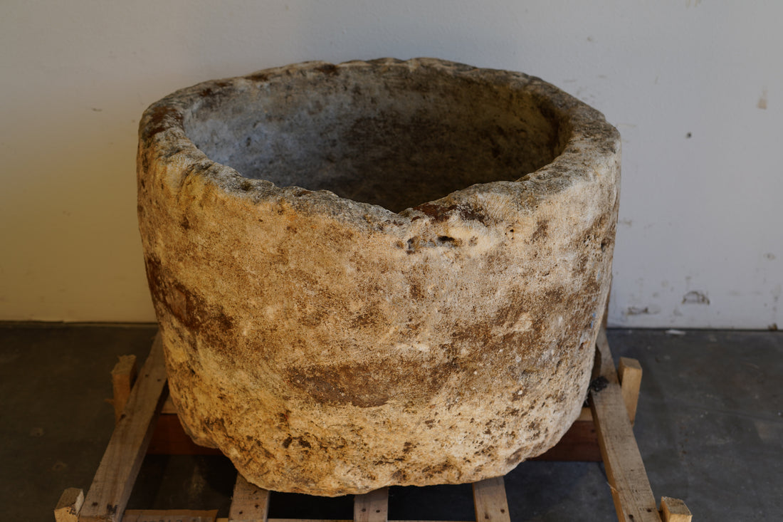 Backside view of Antique Hand Carved Limestone Round Planter 34" D x 22" H with natural aging, patina and character.