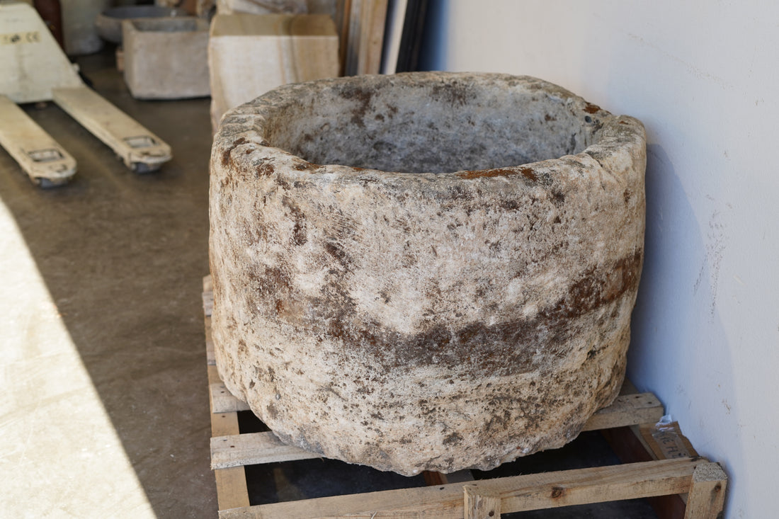 Antique Hand Carved Limestone Round Planter 34" D x 22" H with natural aging, patina and character in shaded natural lighting.