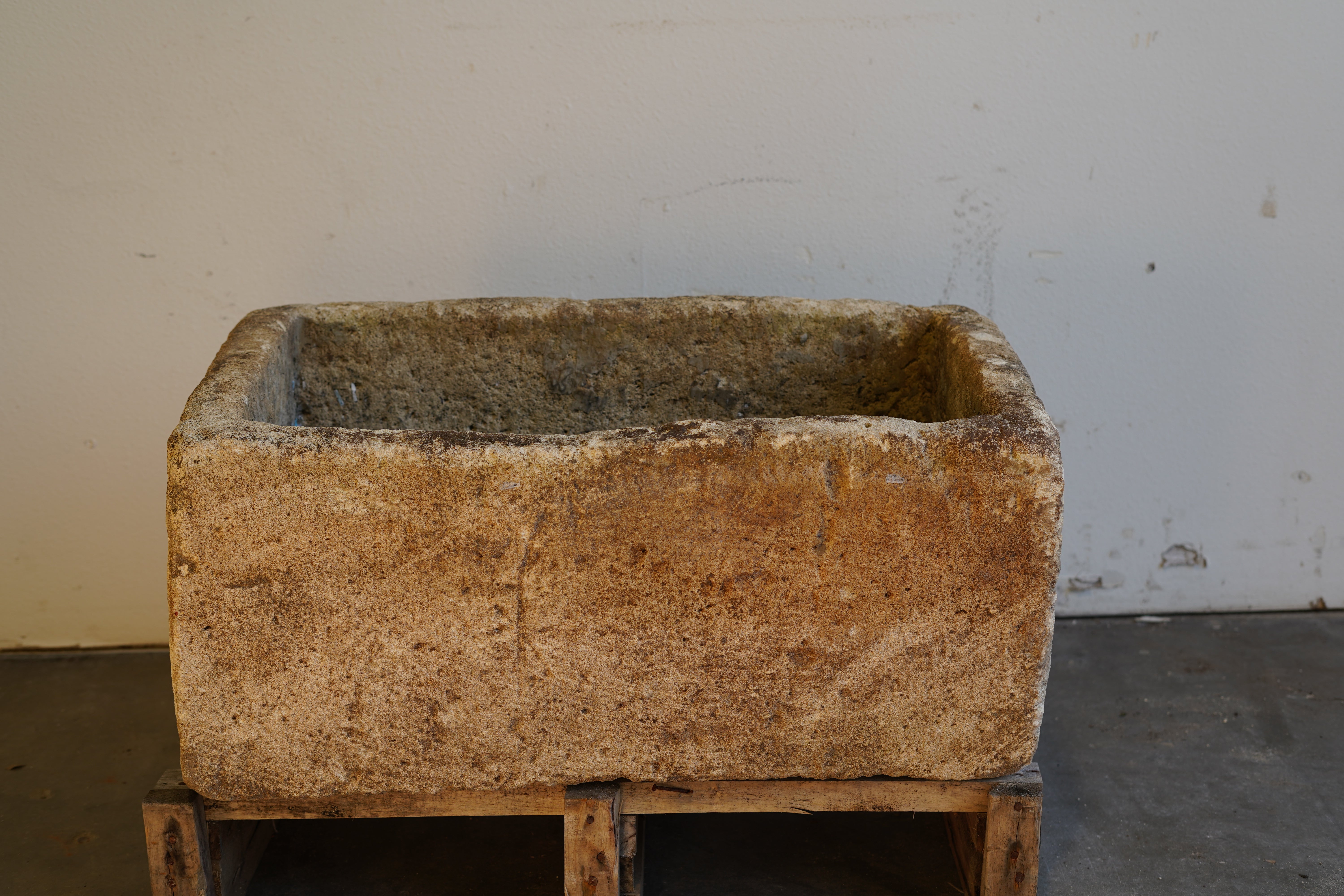 Heavy limestone planter with aged patina – rectangular outdoor decor piece ideal for planting or water features.
