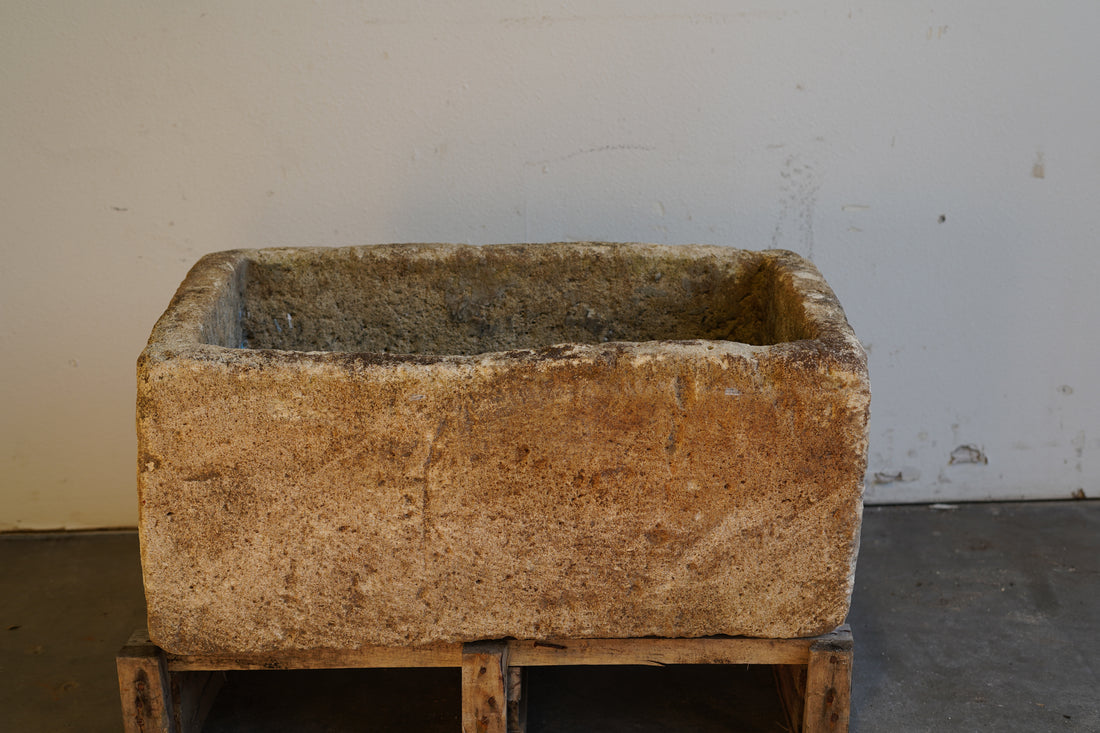 Heavy limestone planter with aged patina – rectangular outdoor decor piece ideal for planting or water features.
