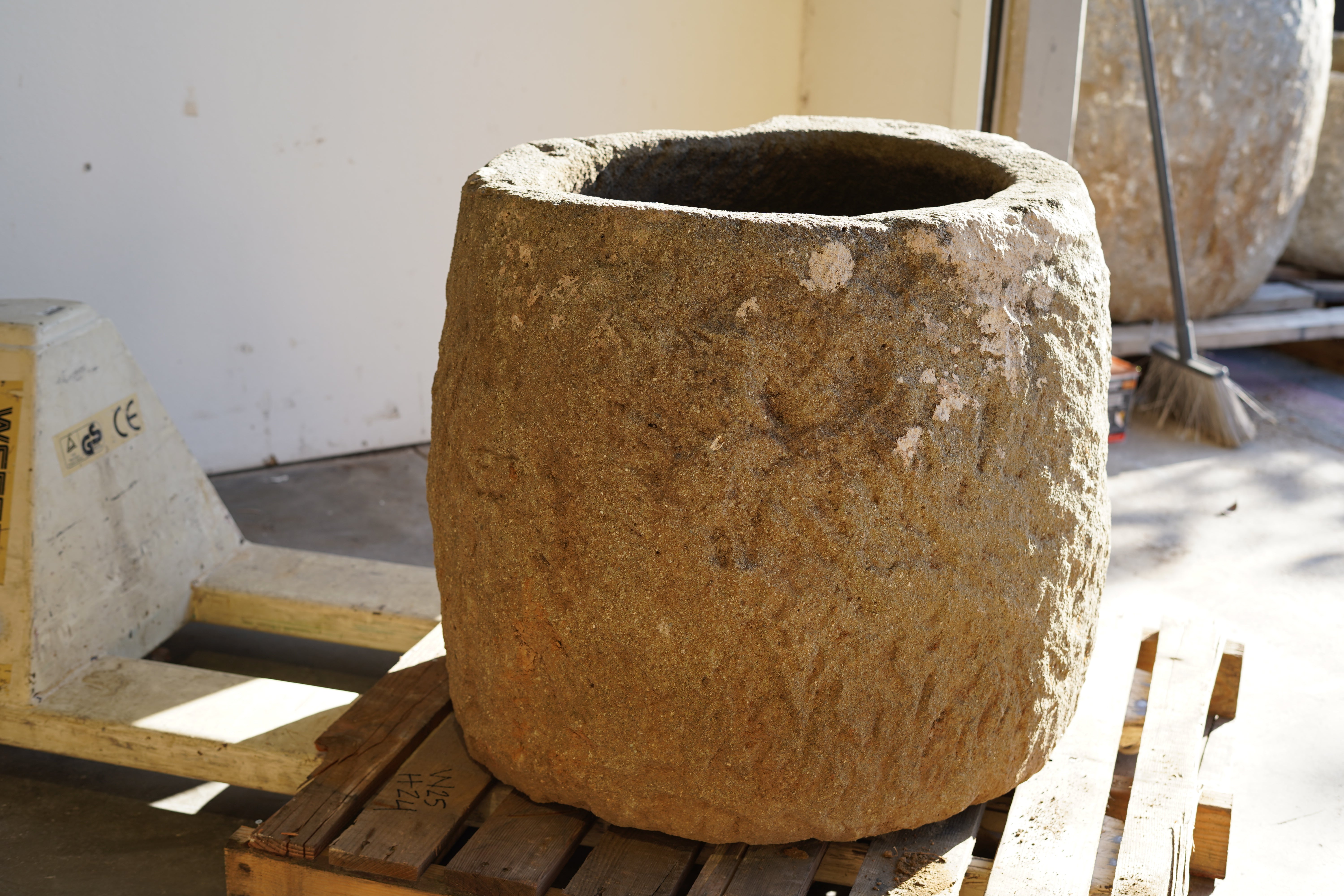 Tall Round Authentic Limestone Planter 25" D x 24" H in natural sunlight.