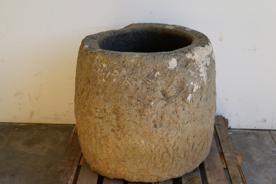straight on view of Tall Round Authentic Limestone Planter 25" D x 24" H 