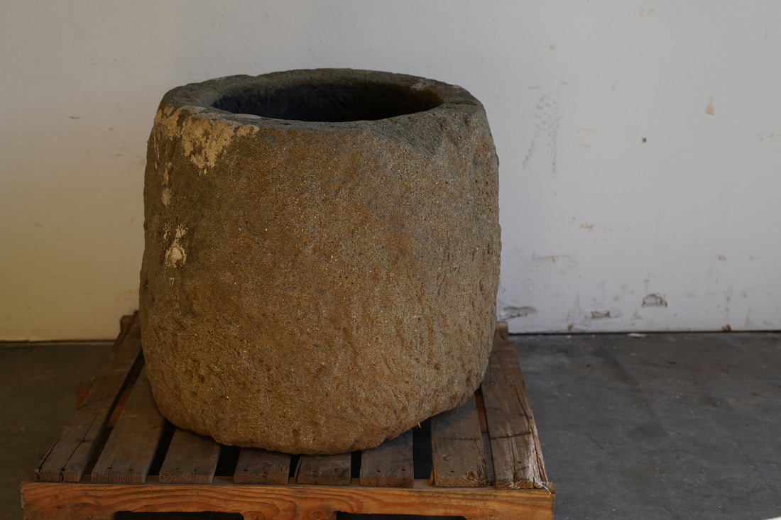 Tall Round Authentic Limestone Planter 25" D x 24" H in shaded lighting.