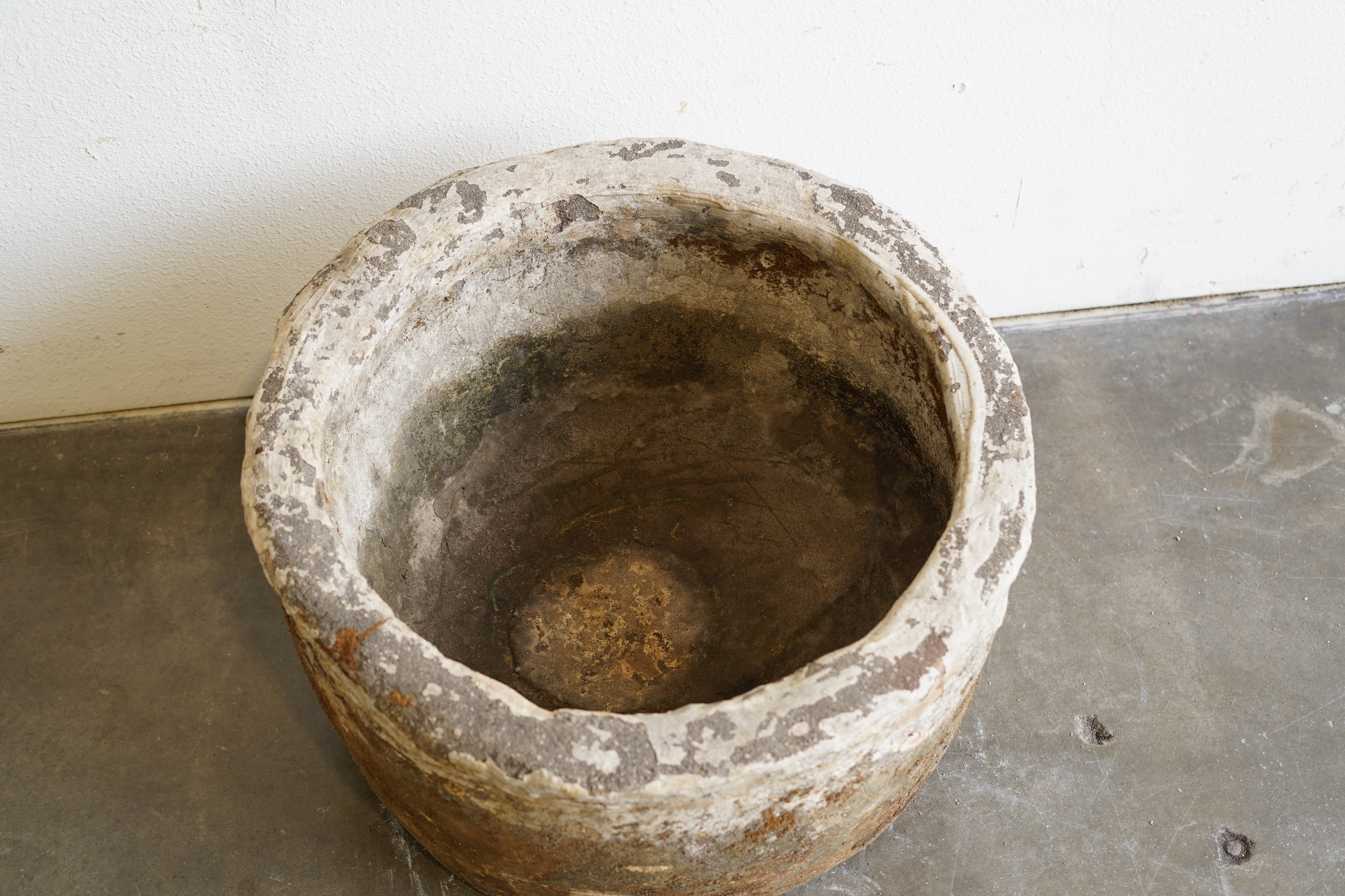 Top down view of Vintage Round Hand-Carved Limestone Vessel, planter. Can be converted into fountain or fire pit. Dimensions: 23" Diameter by 14" H