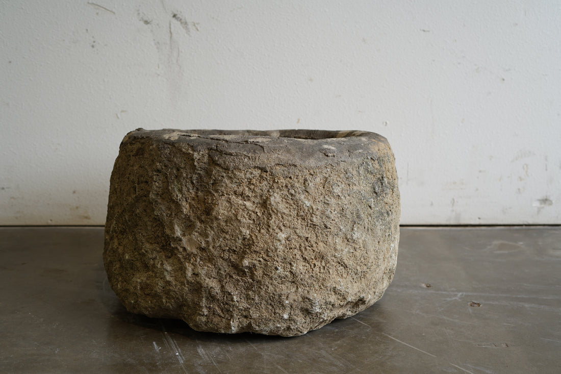 backside view of Vintage hand-carved authentic Limestone planter 