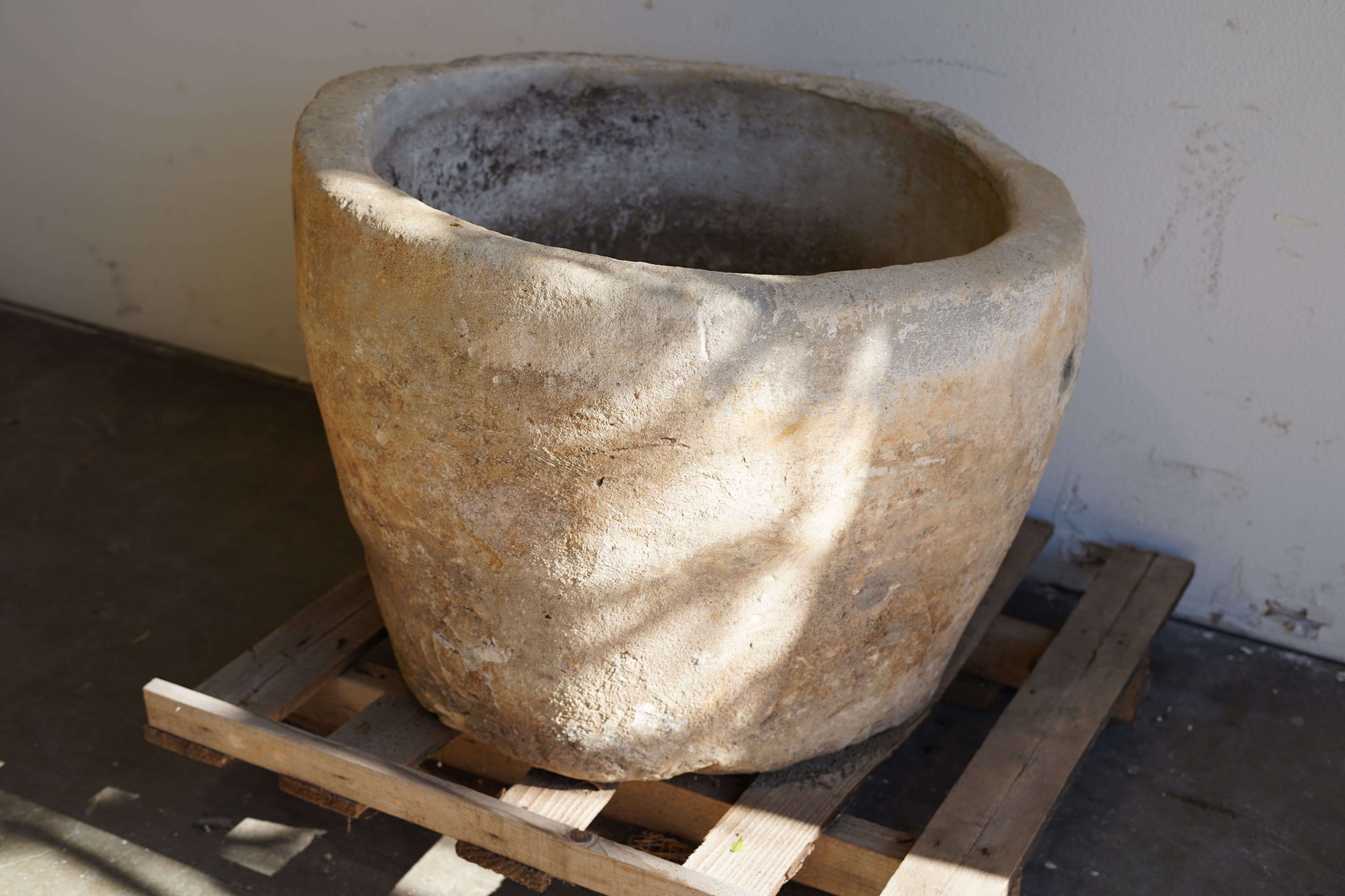 Top view of Vintage Limestone Planter - Round. Dimensions: 23" H x 30" D. Asymmetrical edge.