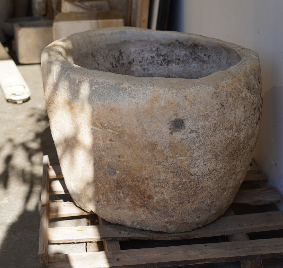 Vintage Limestone Planter - Round. Dimensions: 23" H x 30" D. Shadow from trees.
